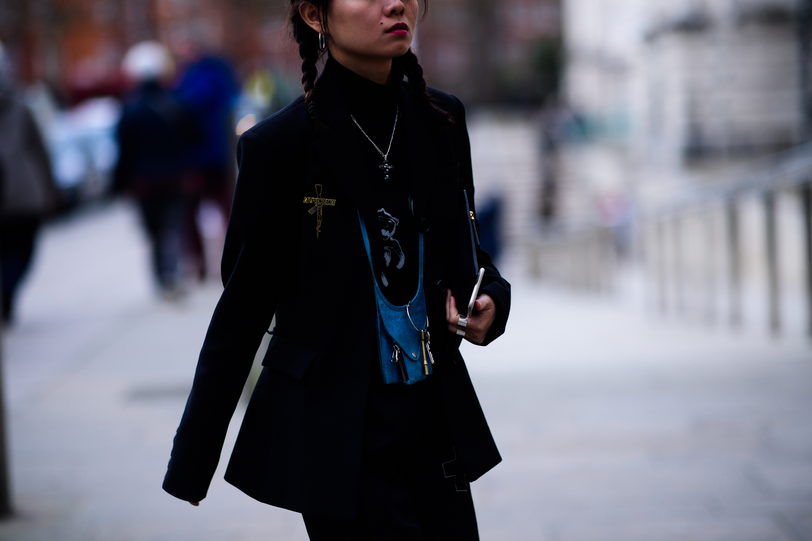 Woman wearing necklace style bag
