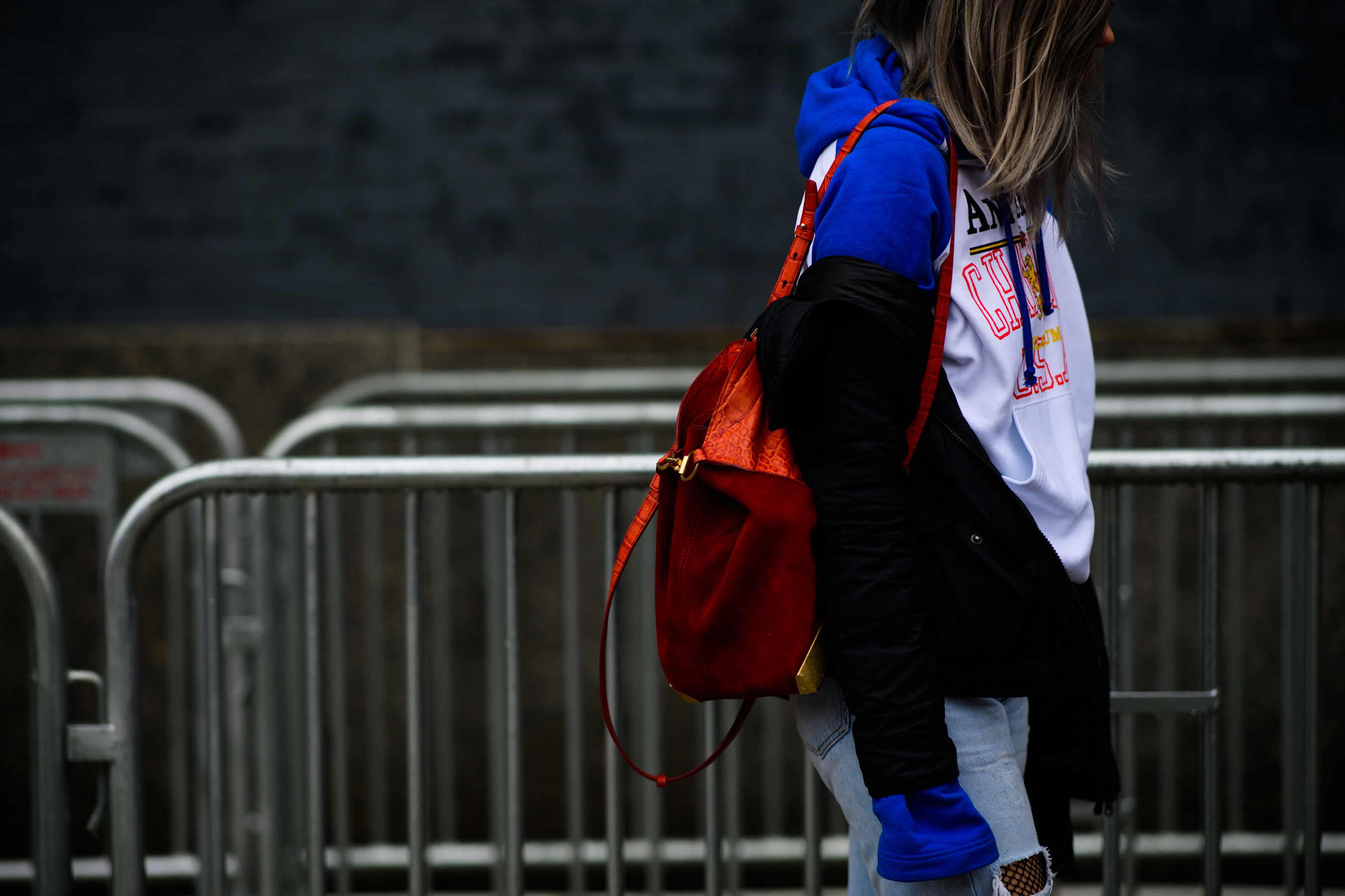 Woman wearing Champion x Vetements hoodie