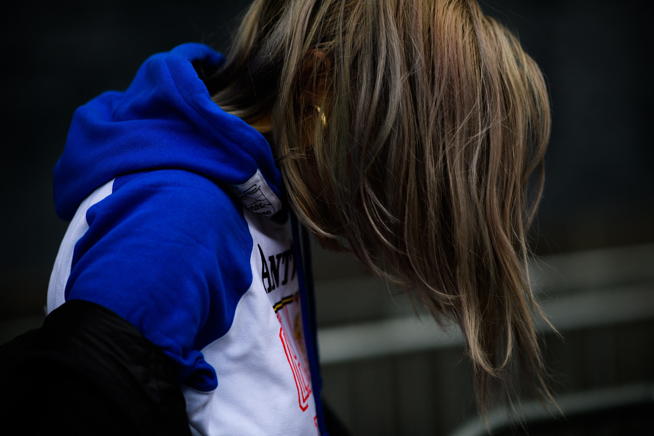 Woman wearing Champion x Vetements hoodie