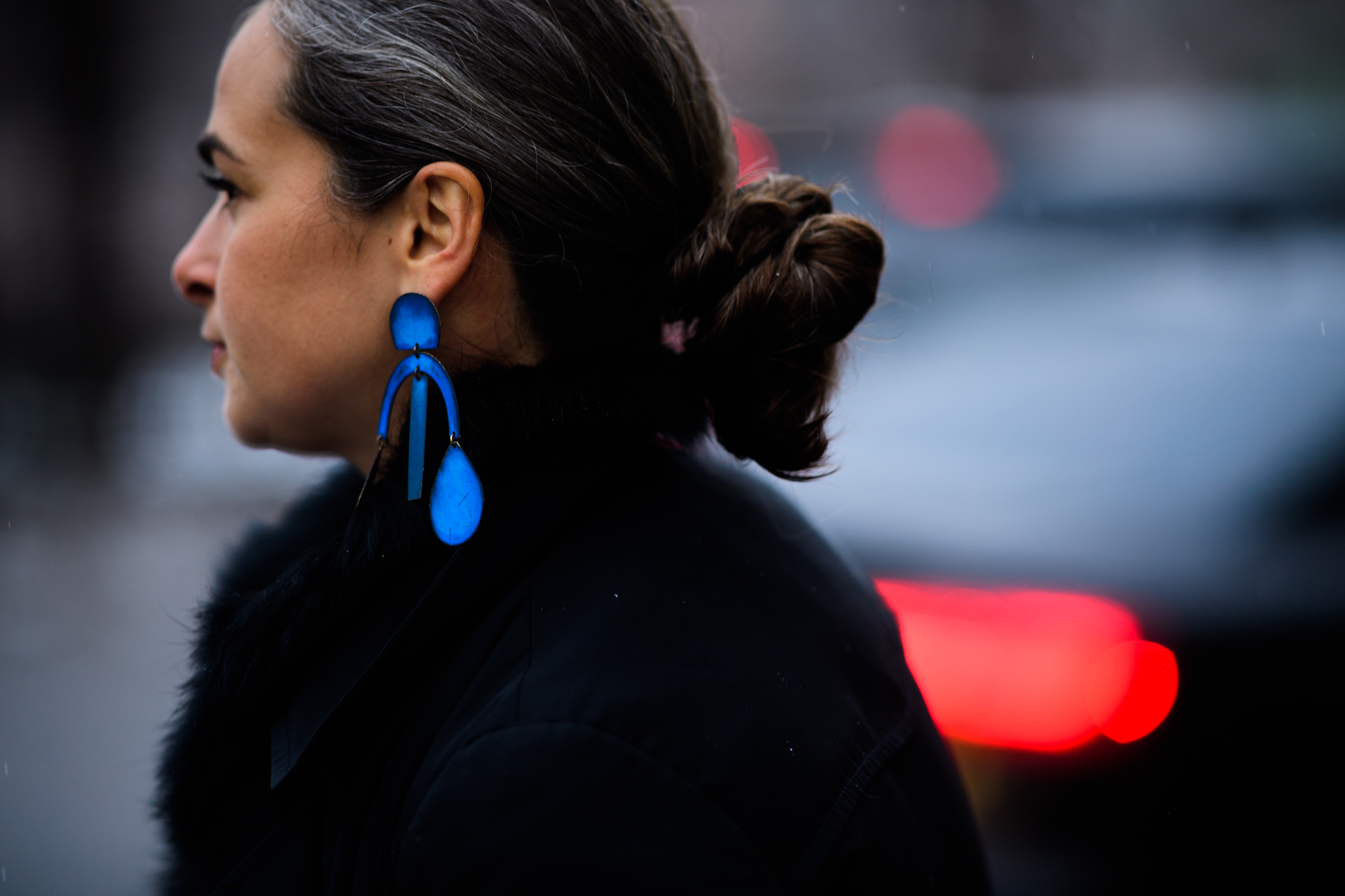 Woman wearing blue earring