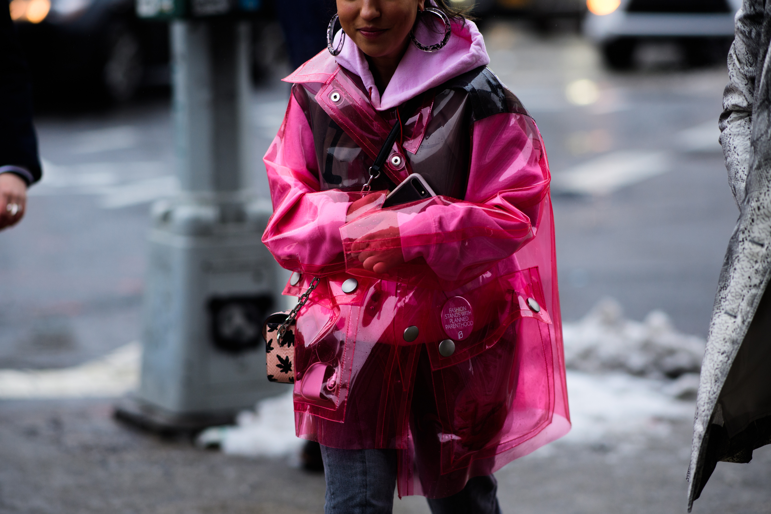 Girl wearing pink rain jacket
