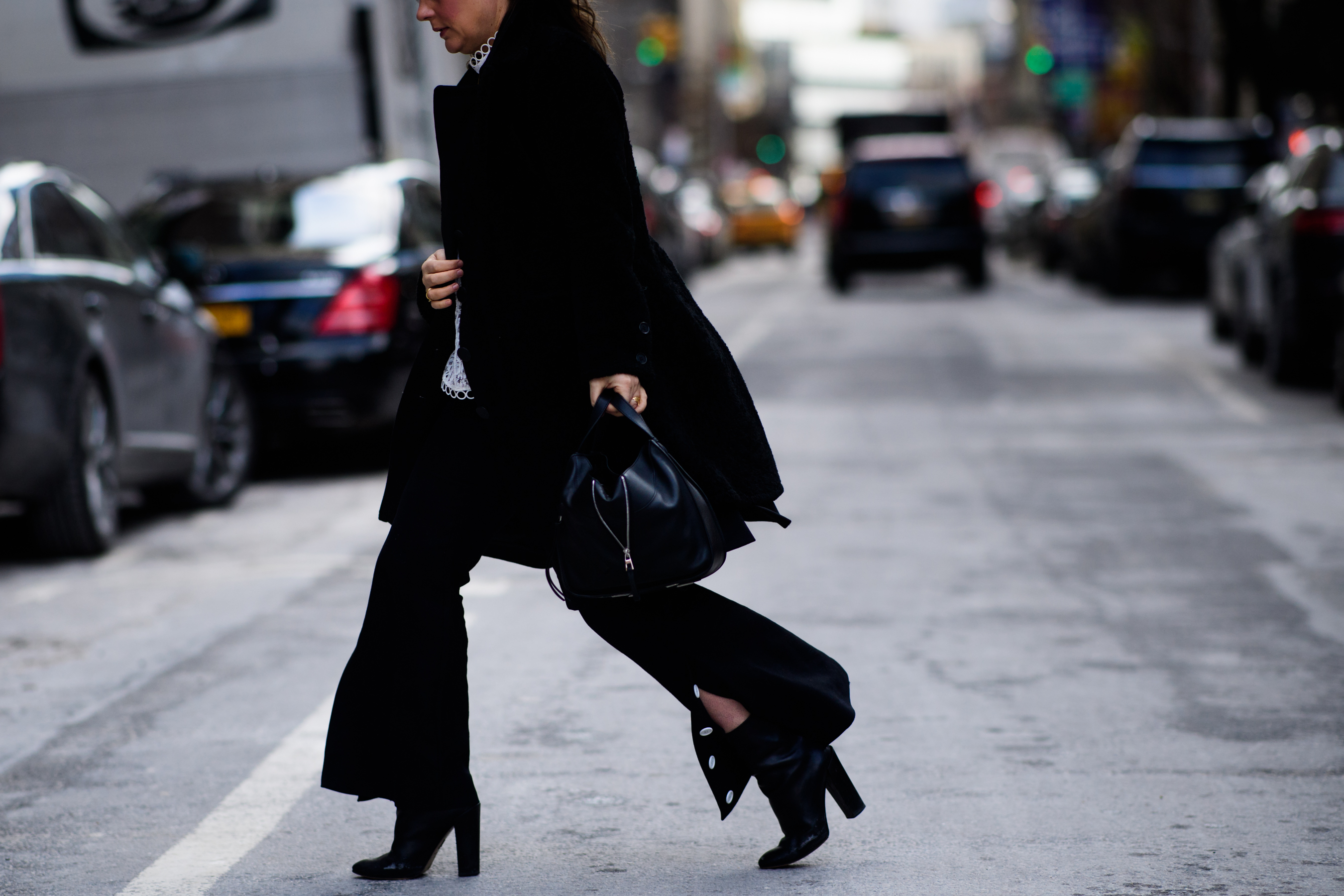 Woman wearing black Ellery pants