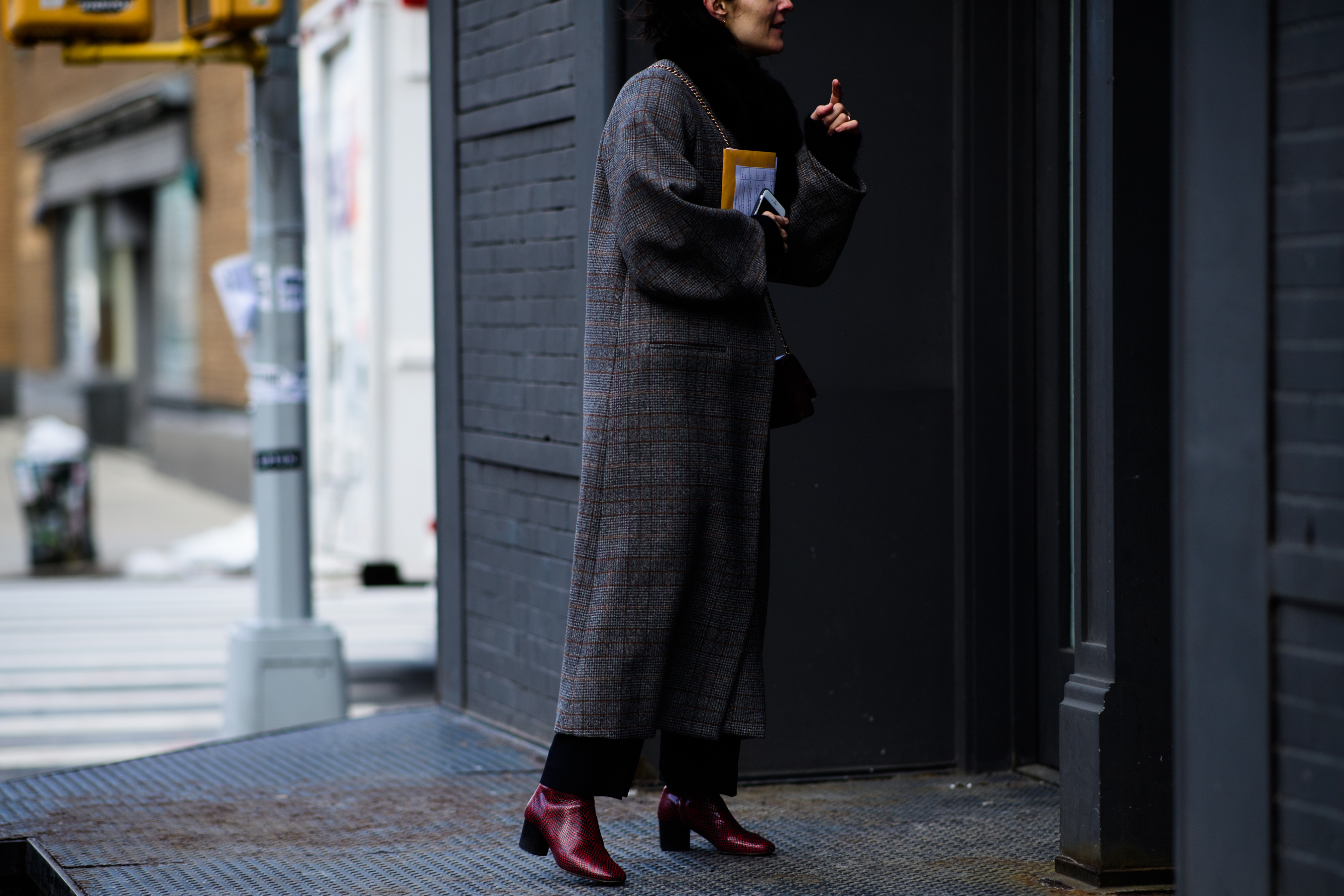Woman wearing long grey coat