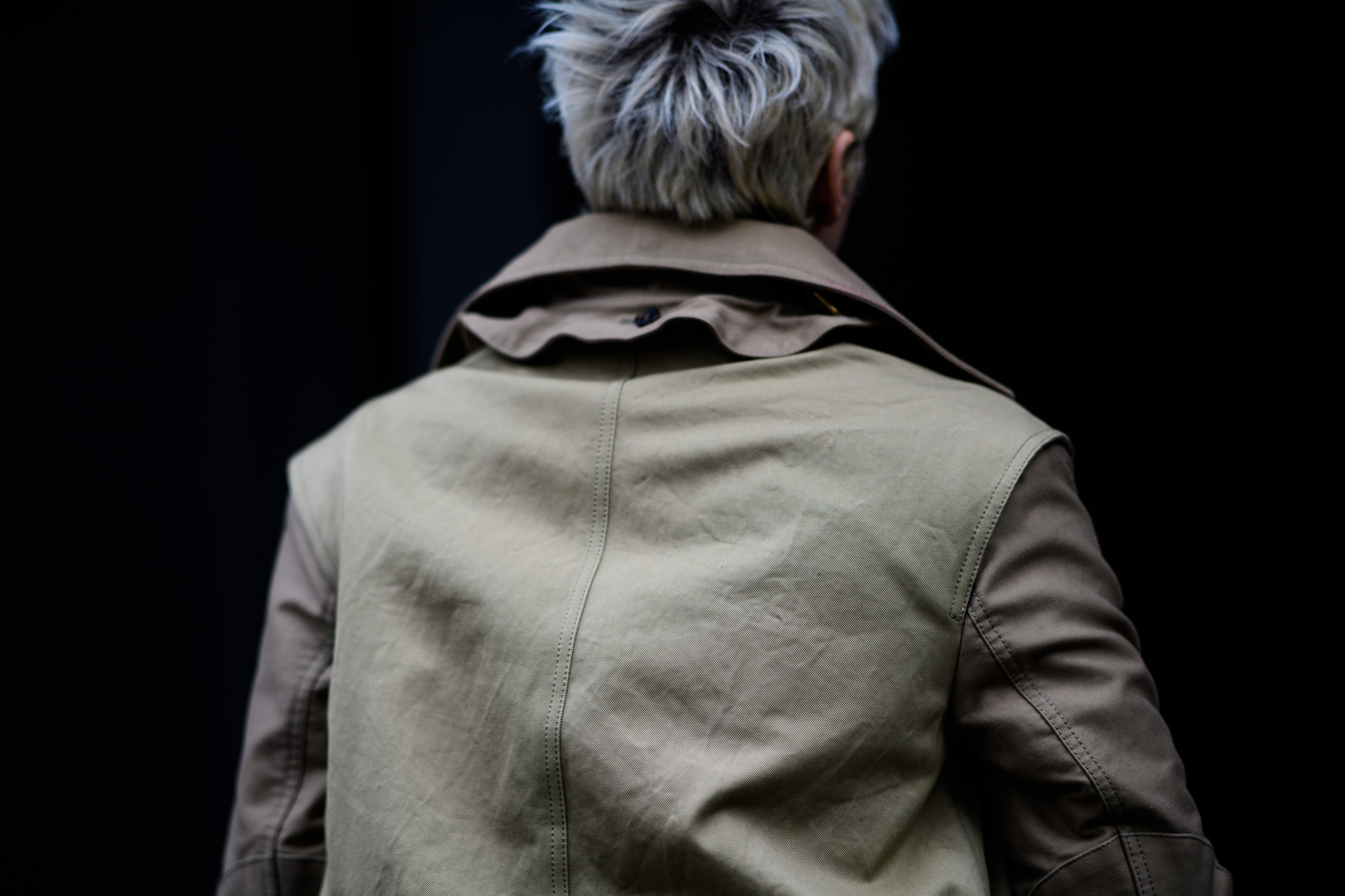 Woman with short hair wearing coat