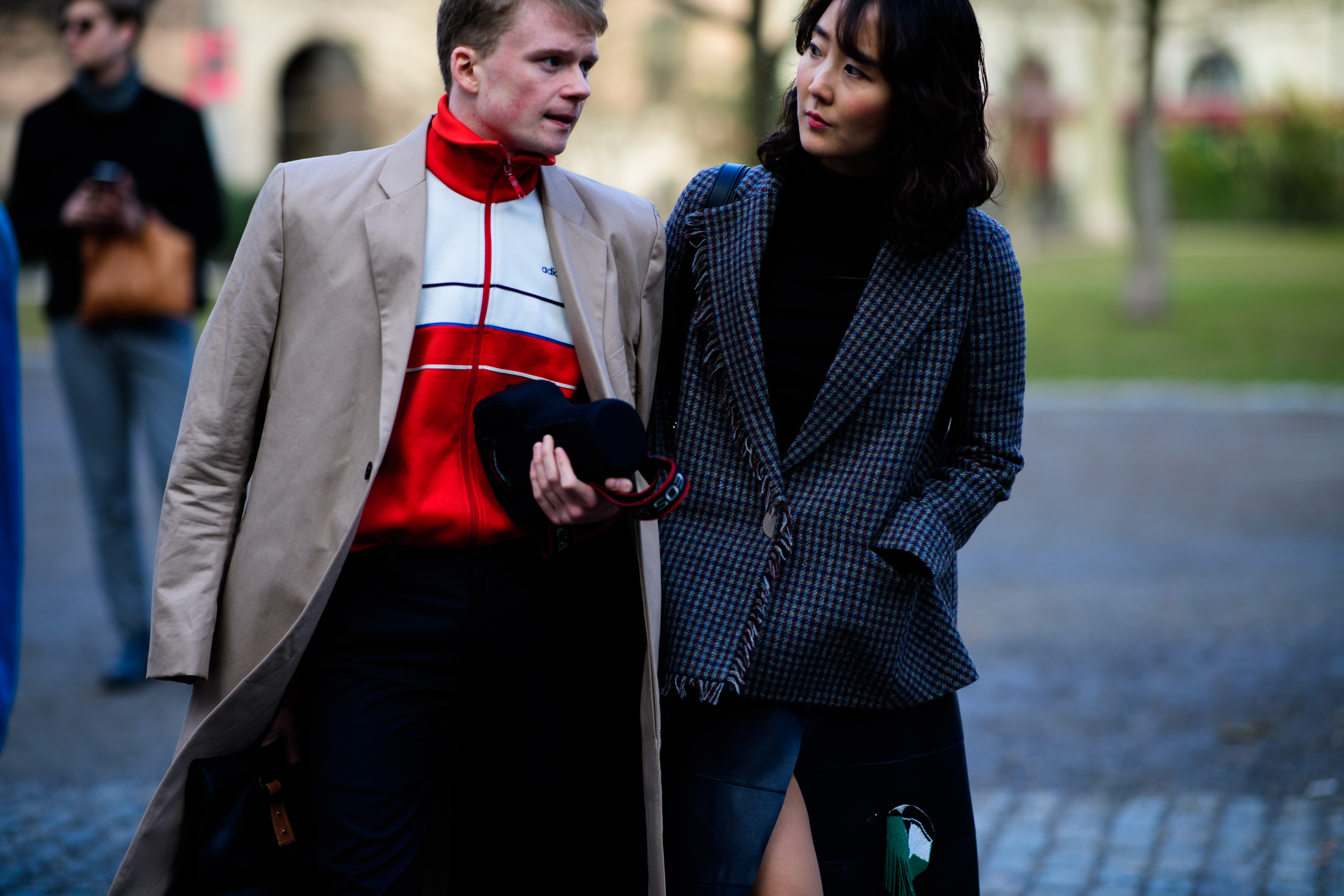 Man wearing adidas jacket under coat