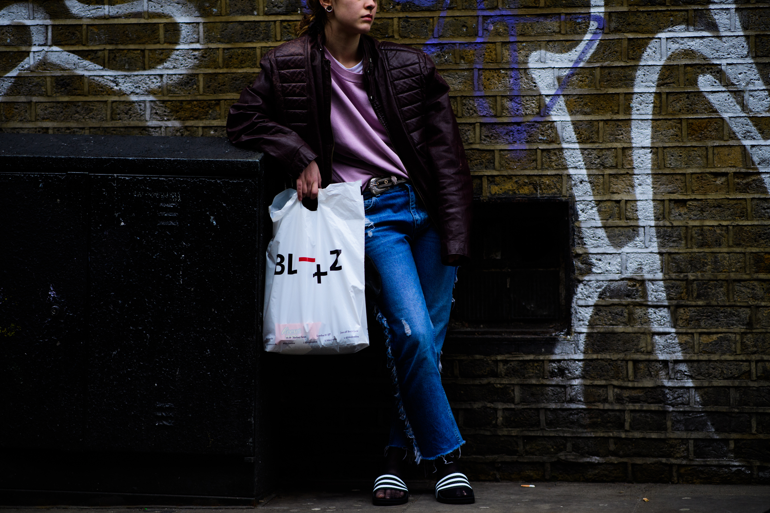 Woman wearing oversized biker jacket