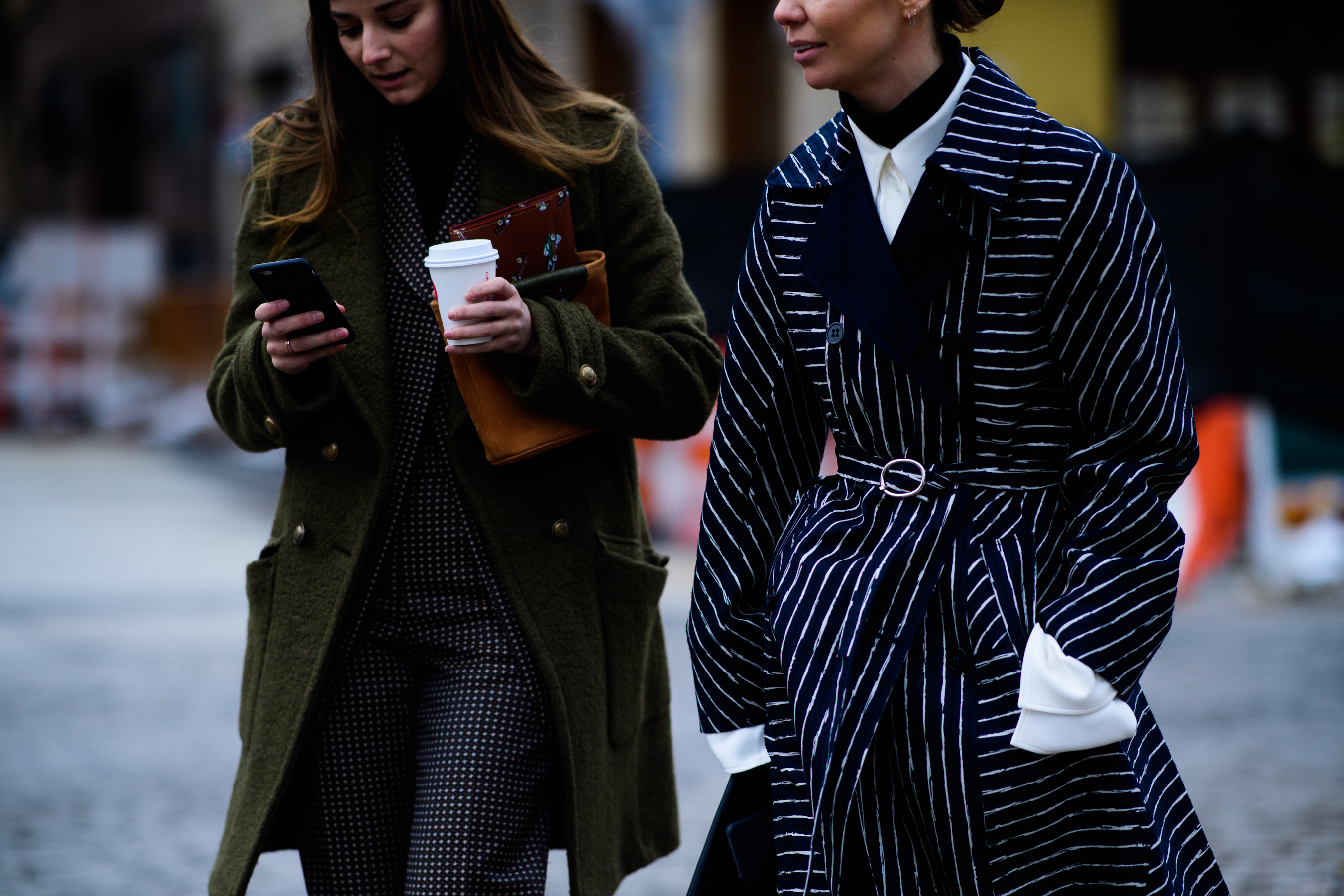 Two women wearing coats