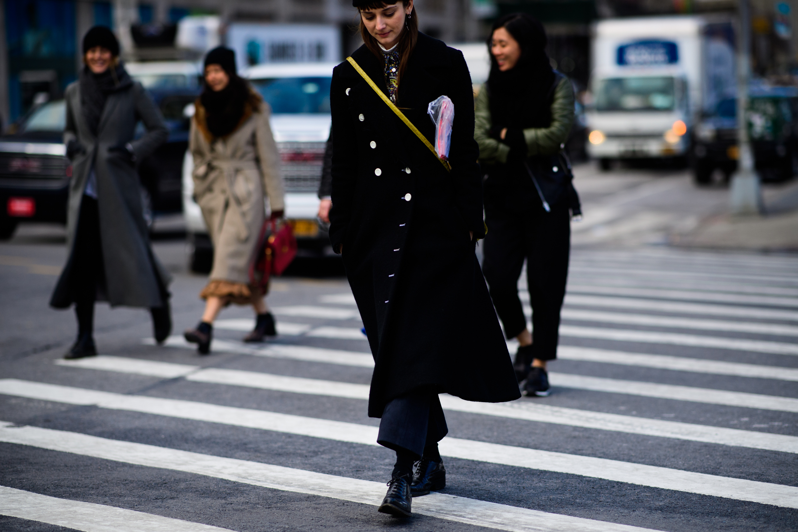 Editor wearing black coat