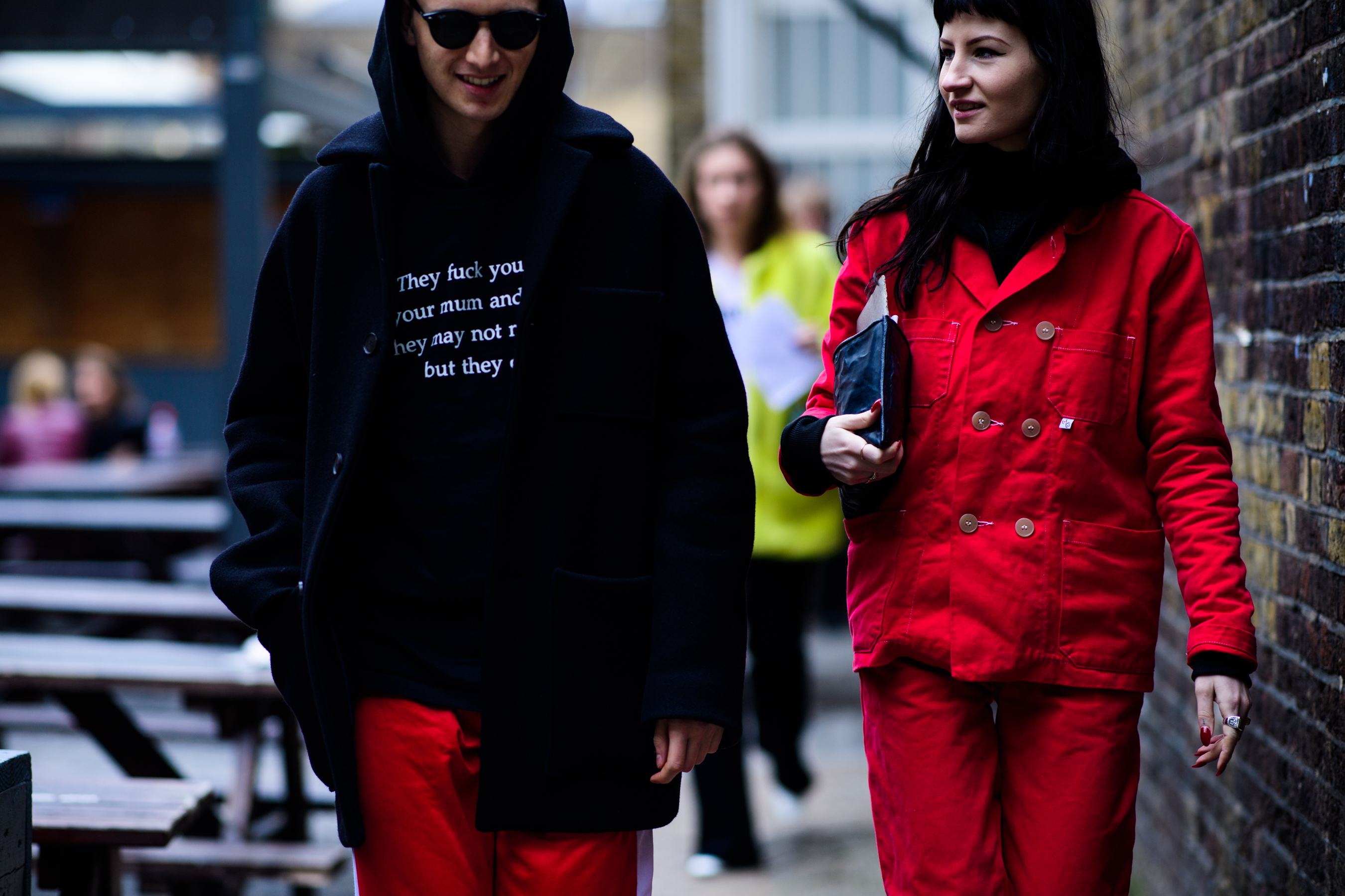 Man wearing Vetements hoodie with text