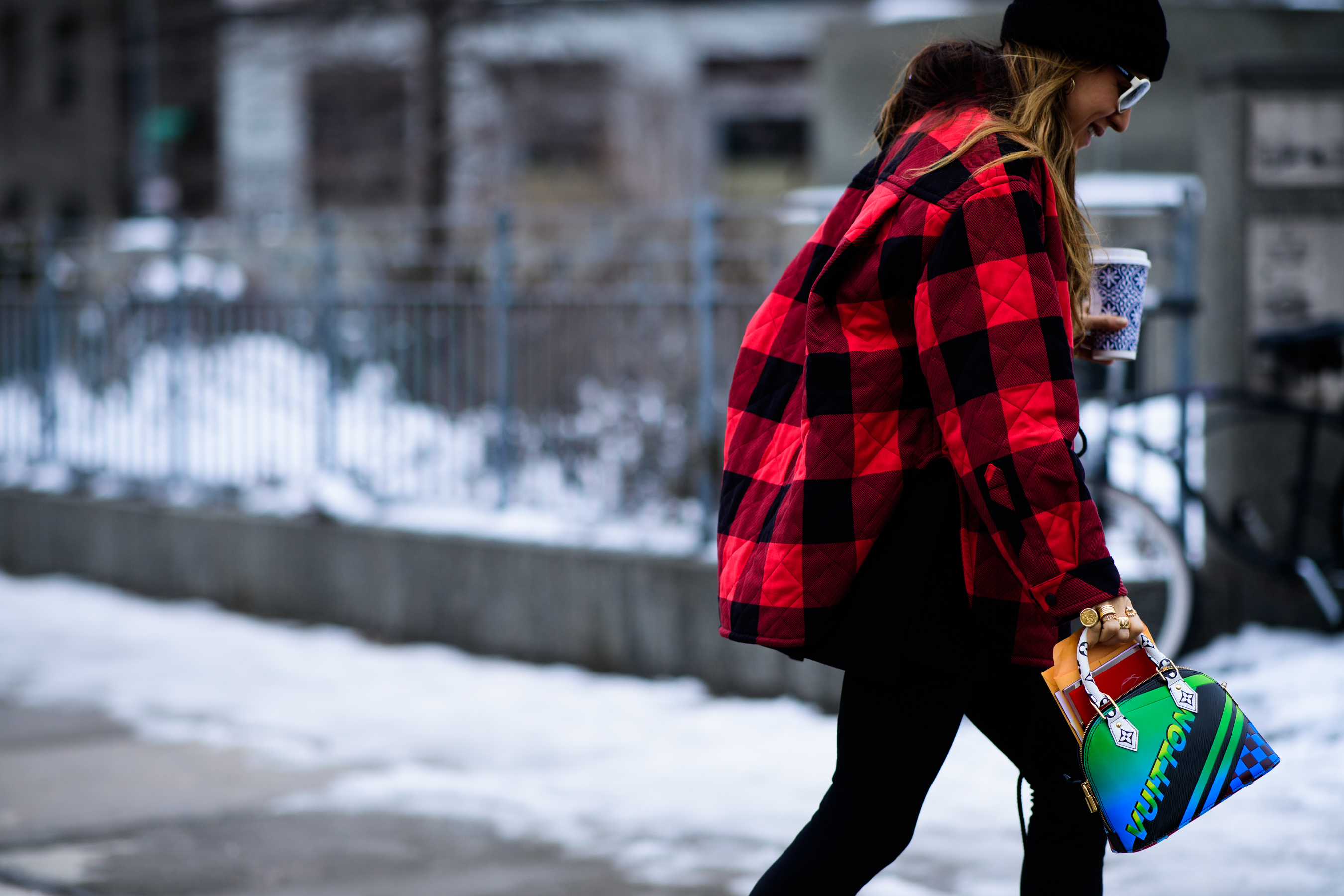 Woman wearing LV handbag