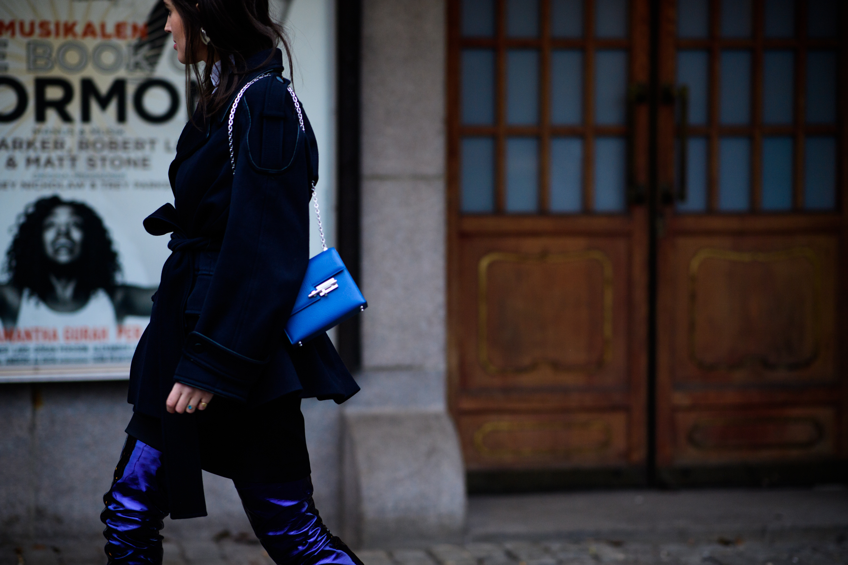 Woman with blue handbag