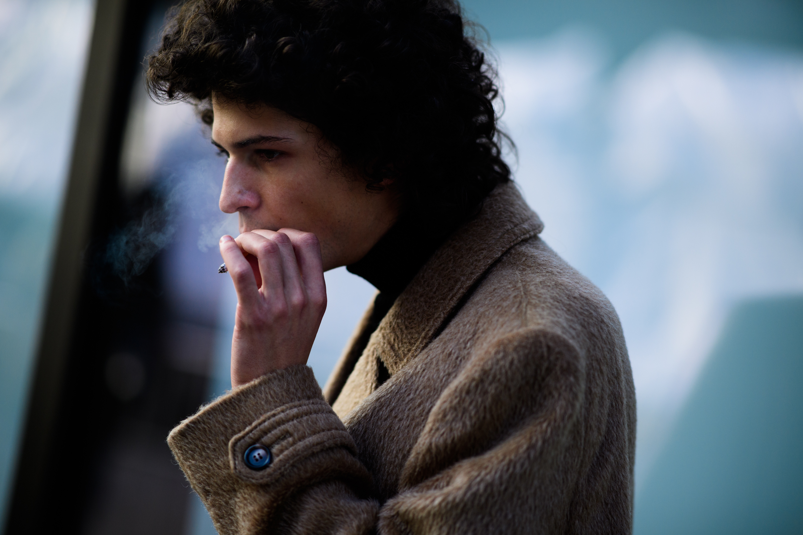 Model wearing brown coat