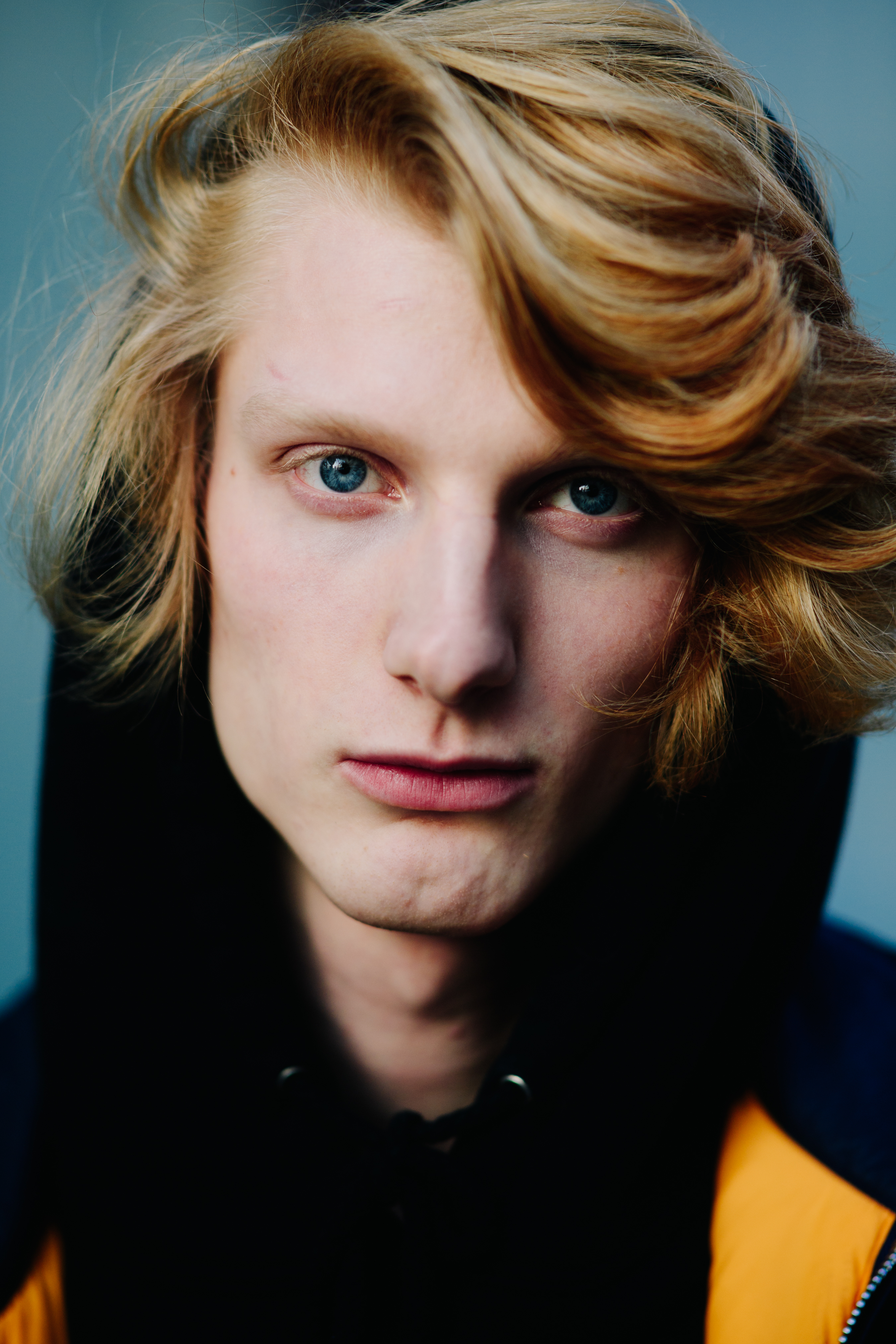 Portrait of model with long hair and blue eyes