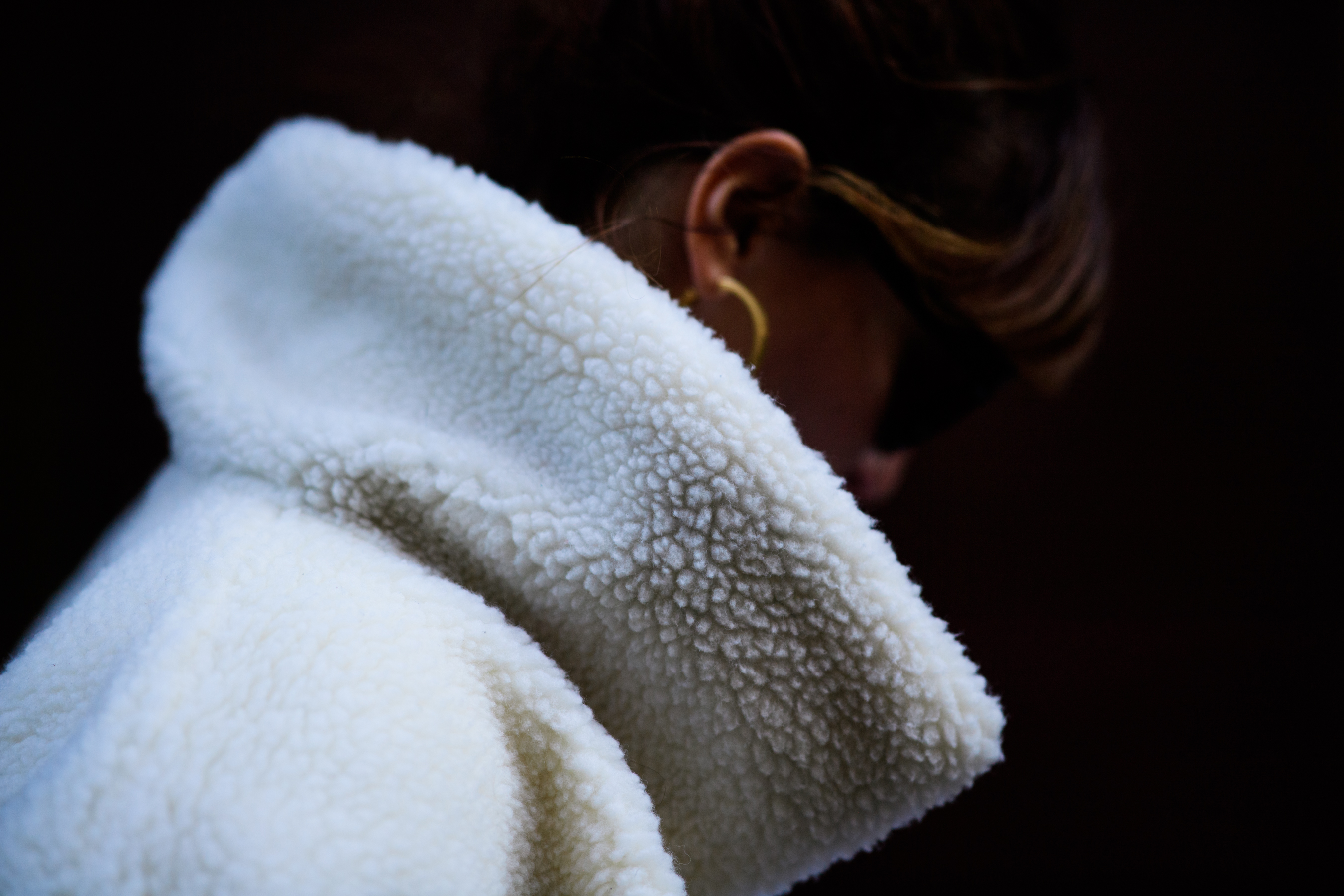 Woman wearing white fur coat