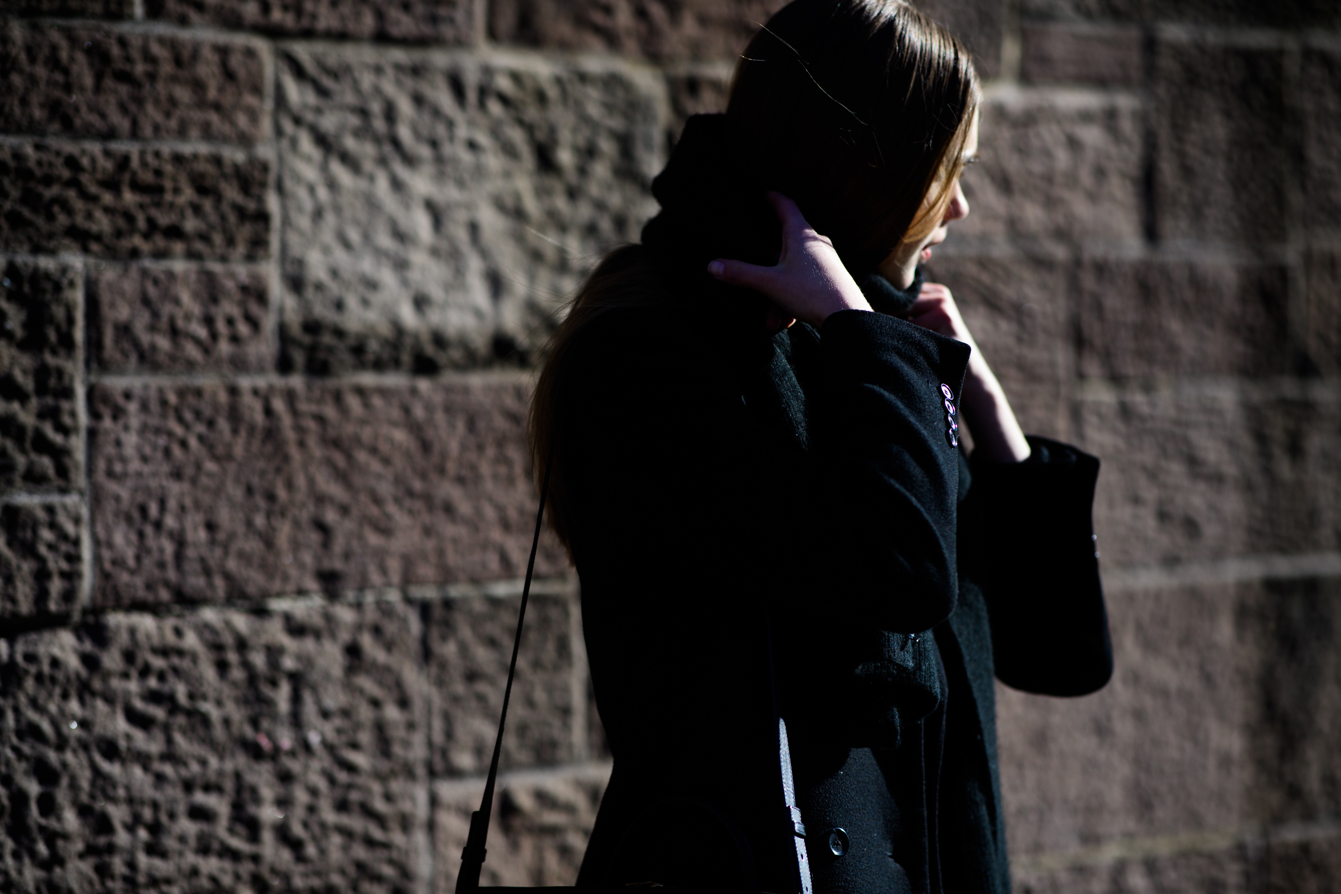 Model putting her scarf on