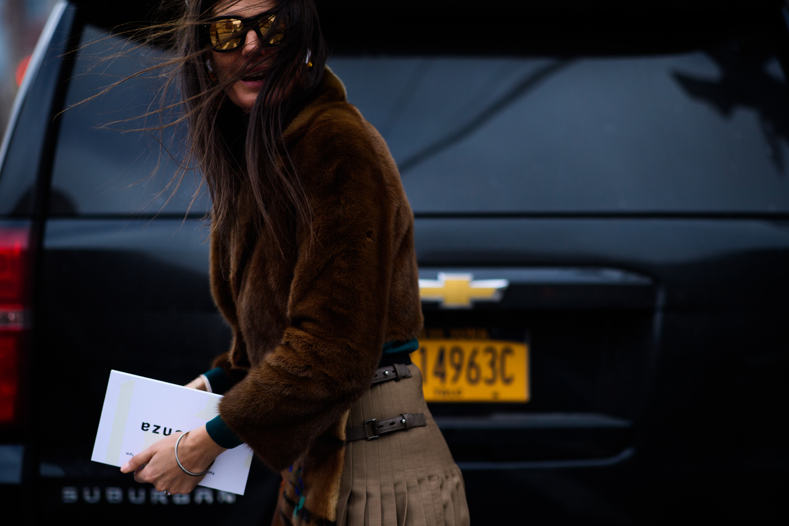 Italian stylist wearing fur jacket