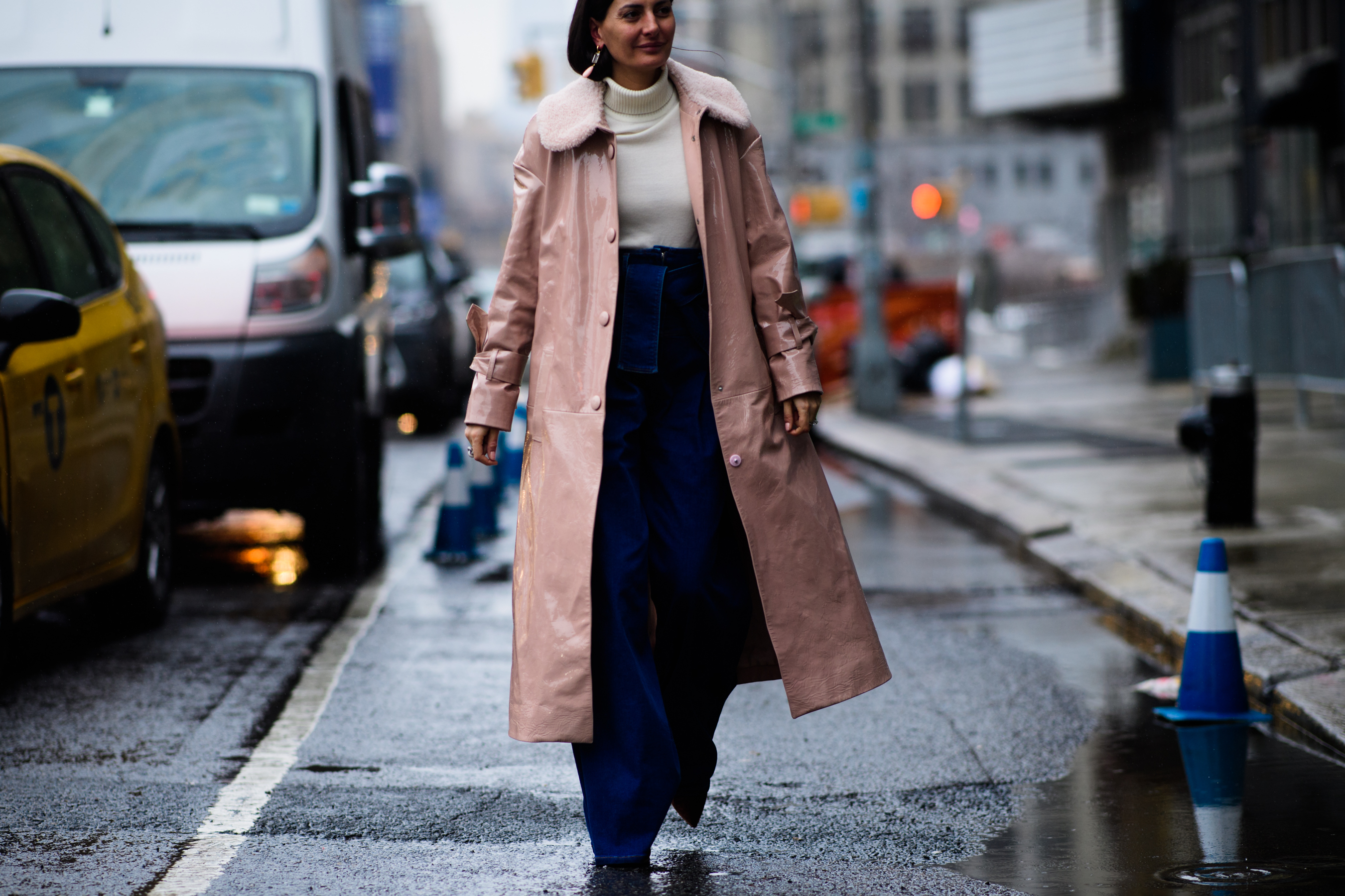 Italian stylist wearing long pink coat