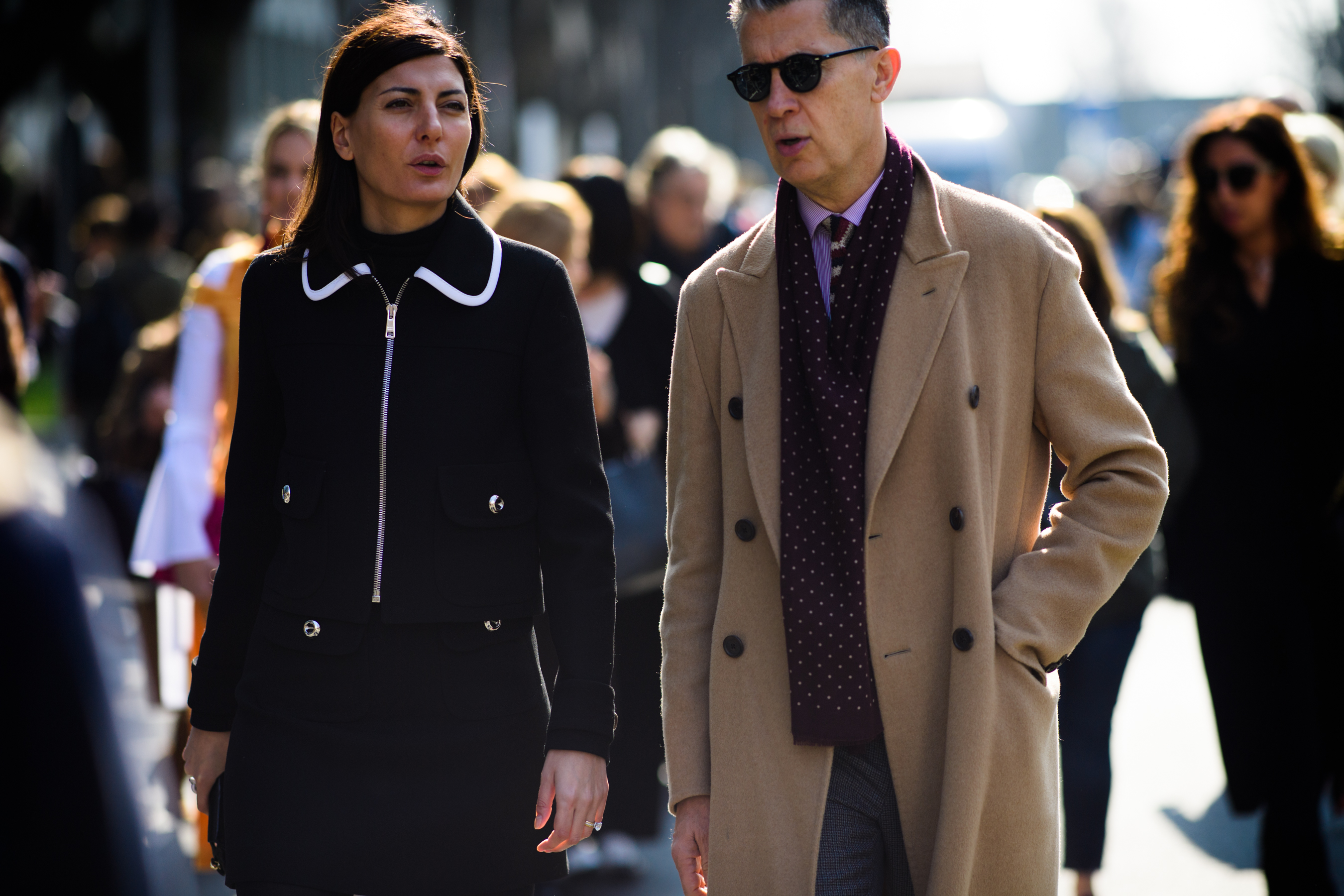 People wearing beige and black clothes
