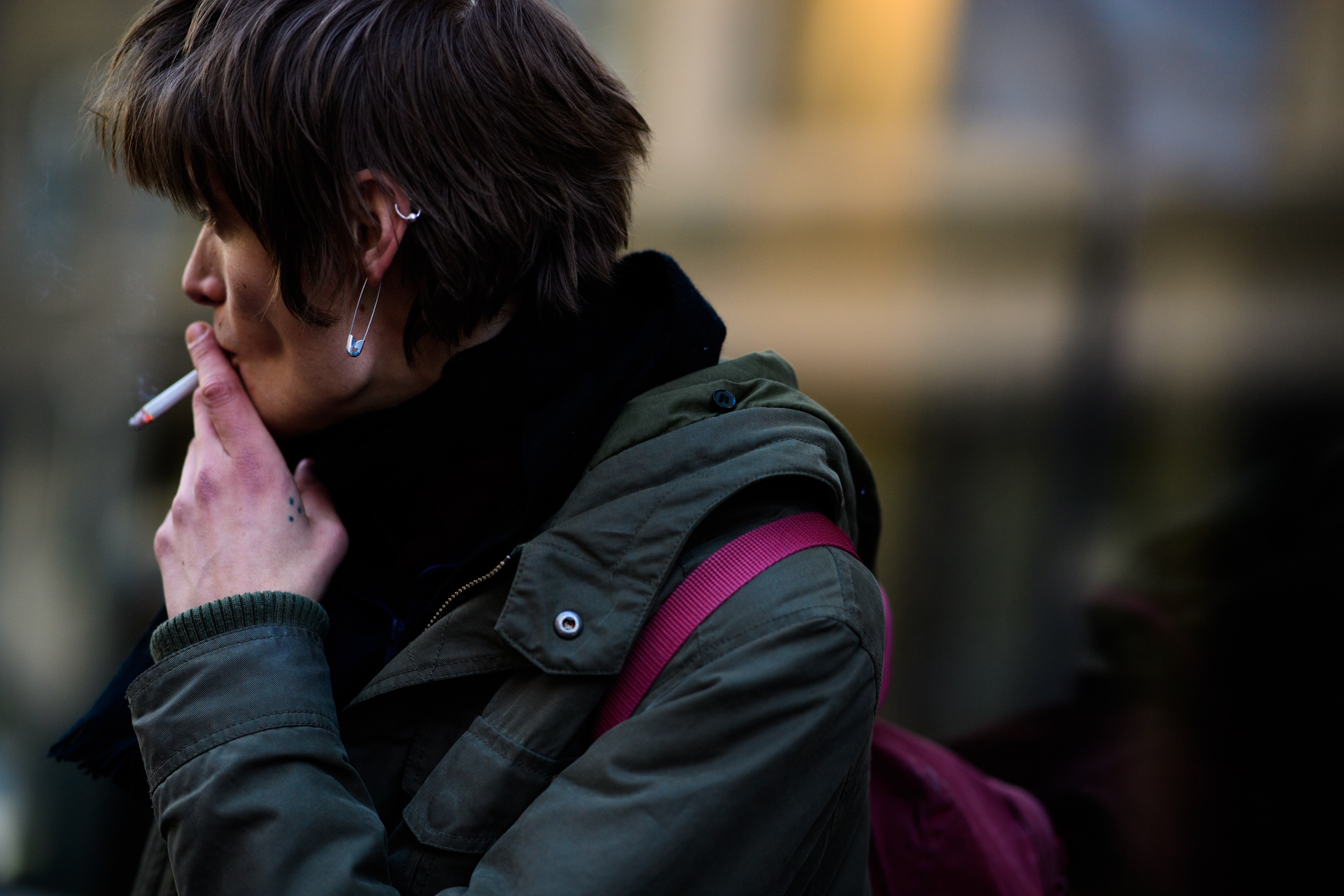 Male model wearing pink backpack
