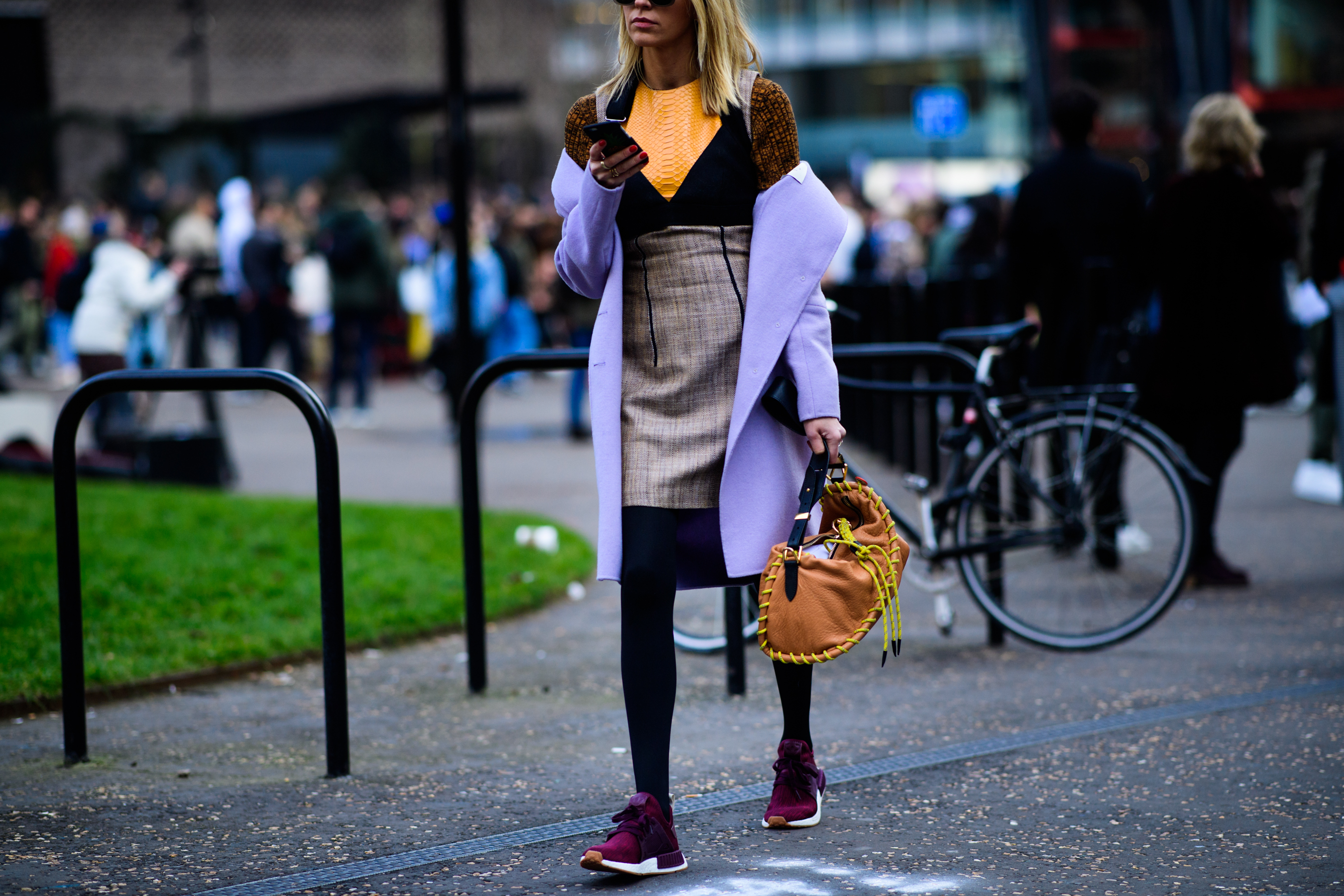 Woman wearing brown handbag