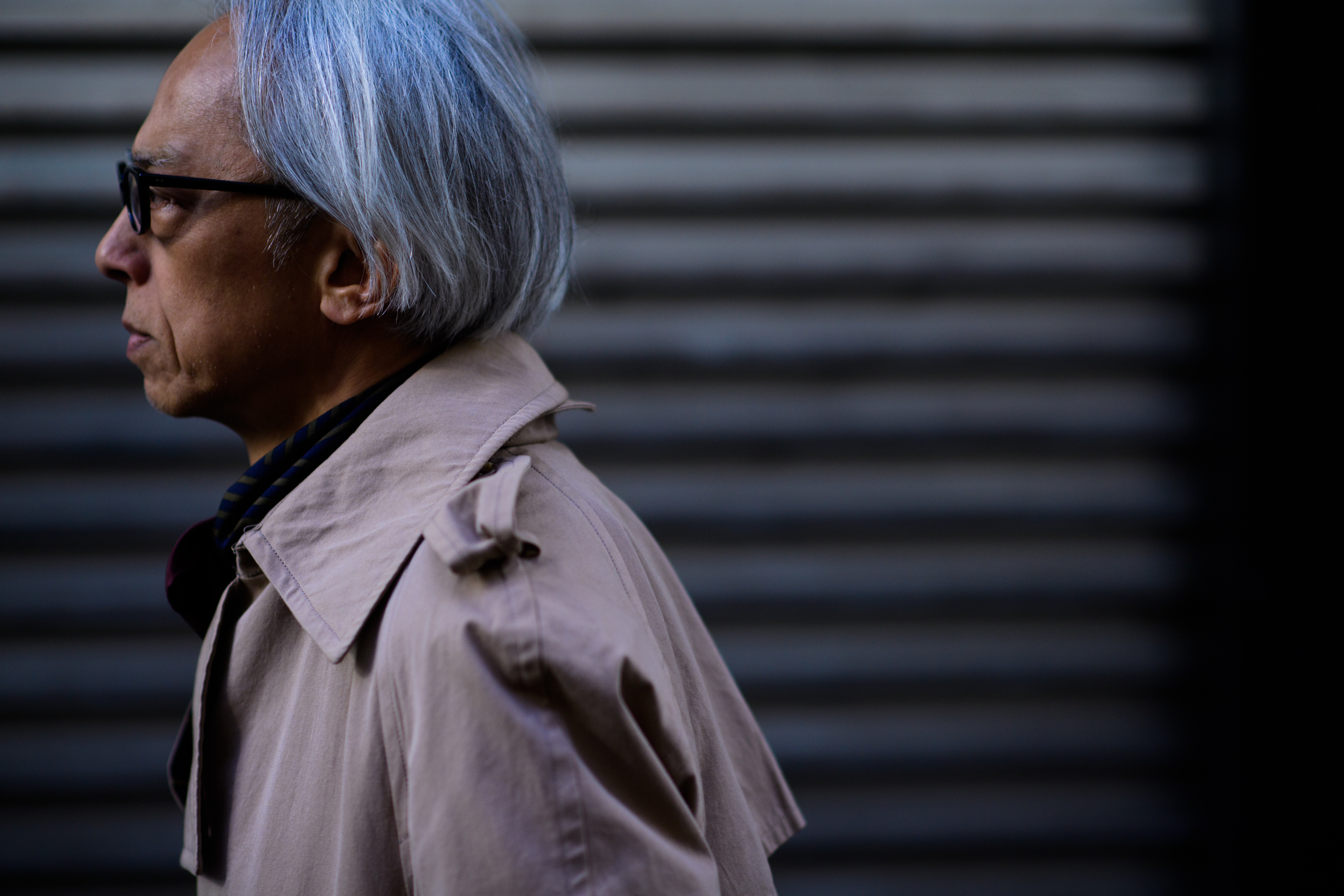 Japanese man wearing beige trench coat