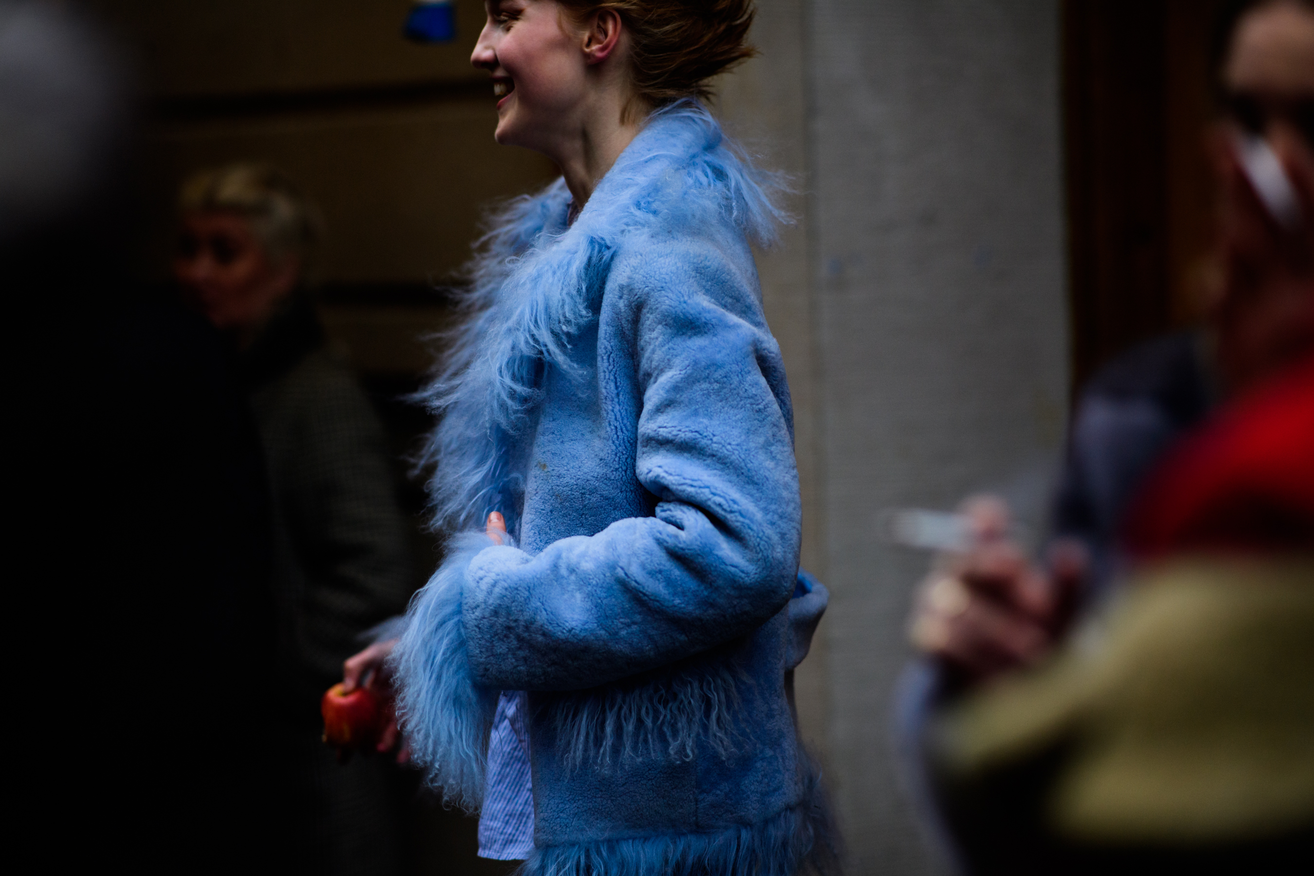 Woman wearing blue fur coat