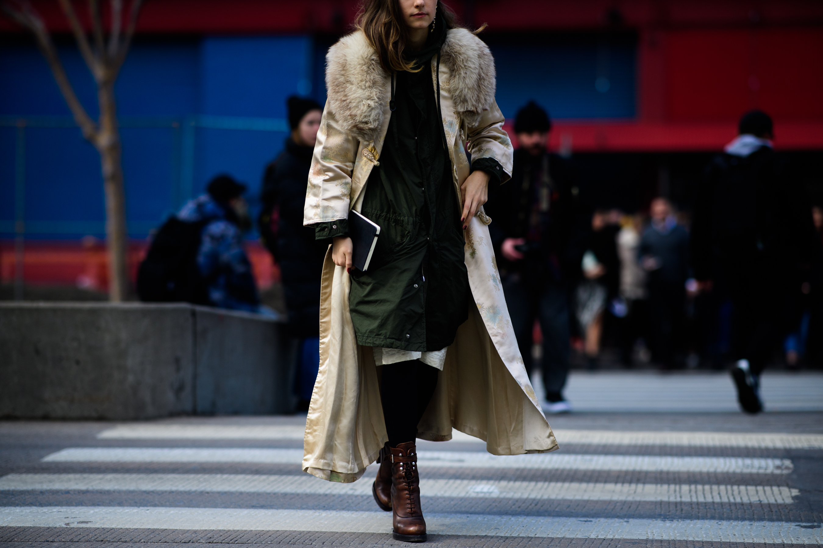 Woman wearing coat with fur collar