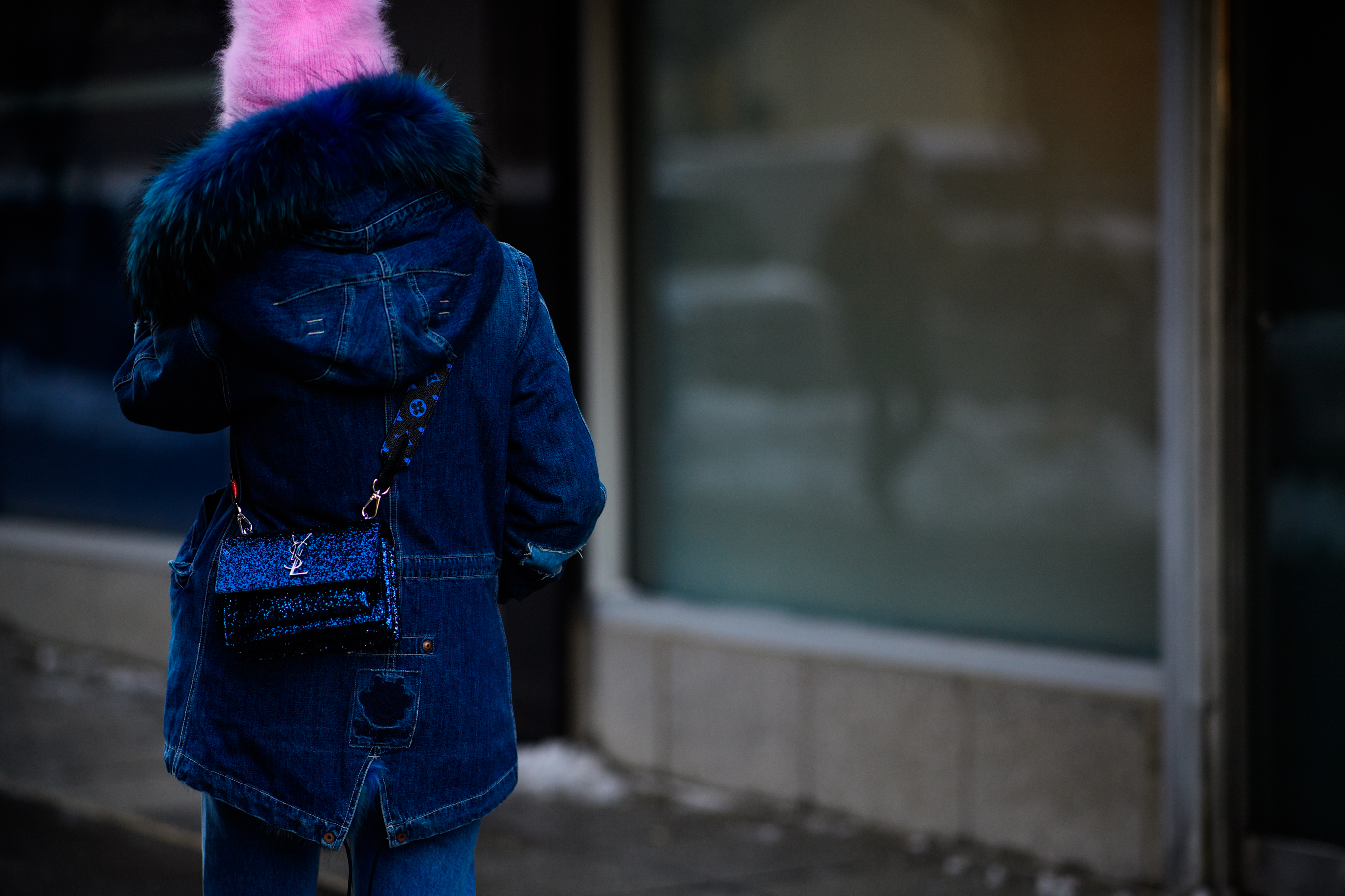 Woman wearing Saint Louren handbag