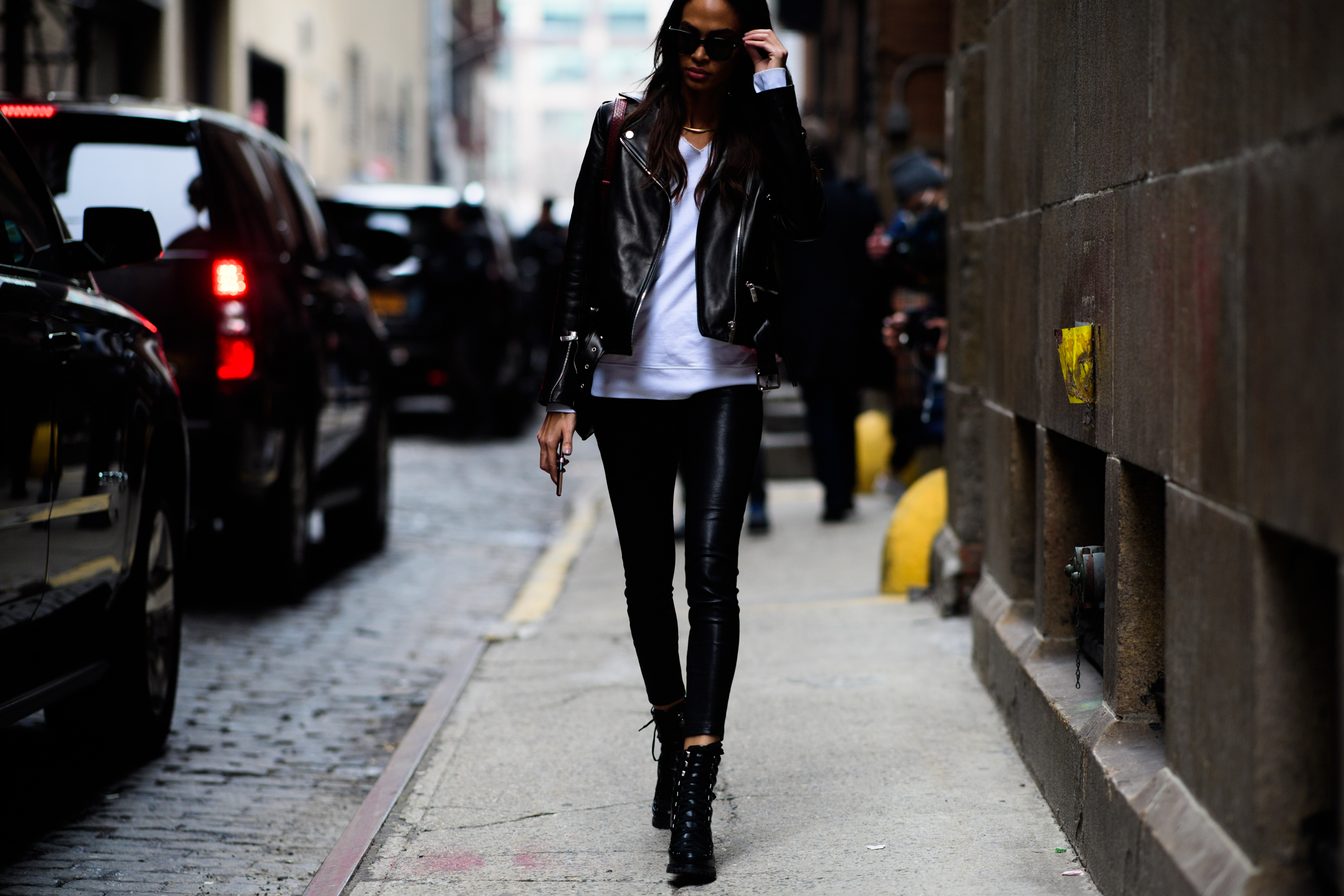 Model wearing leather jacket and white t-shirt