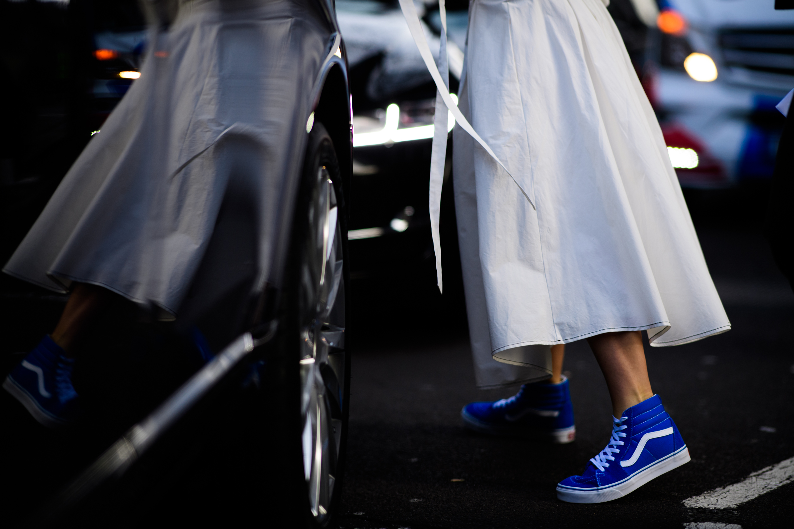 British woman wearing Vans with dress