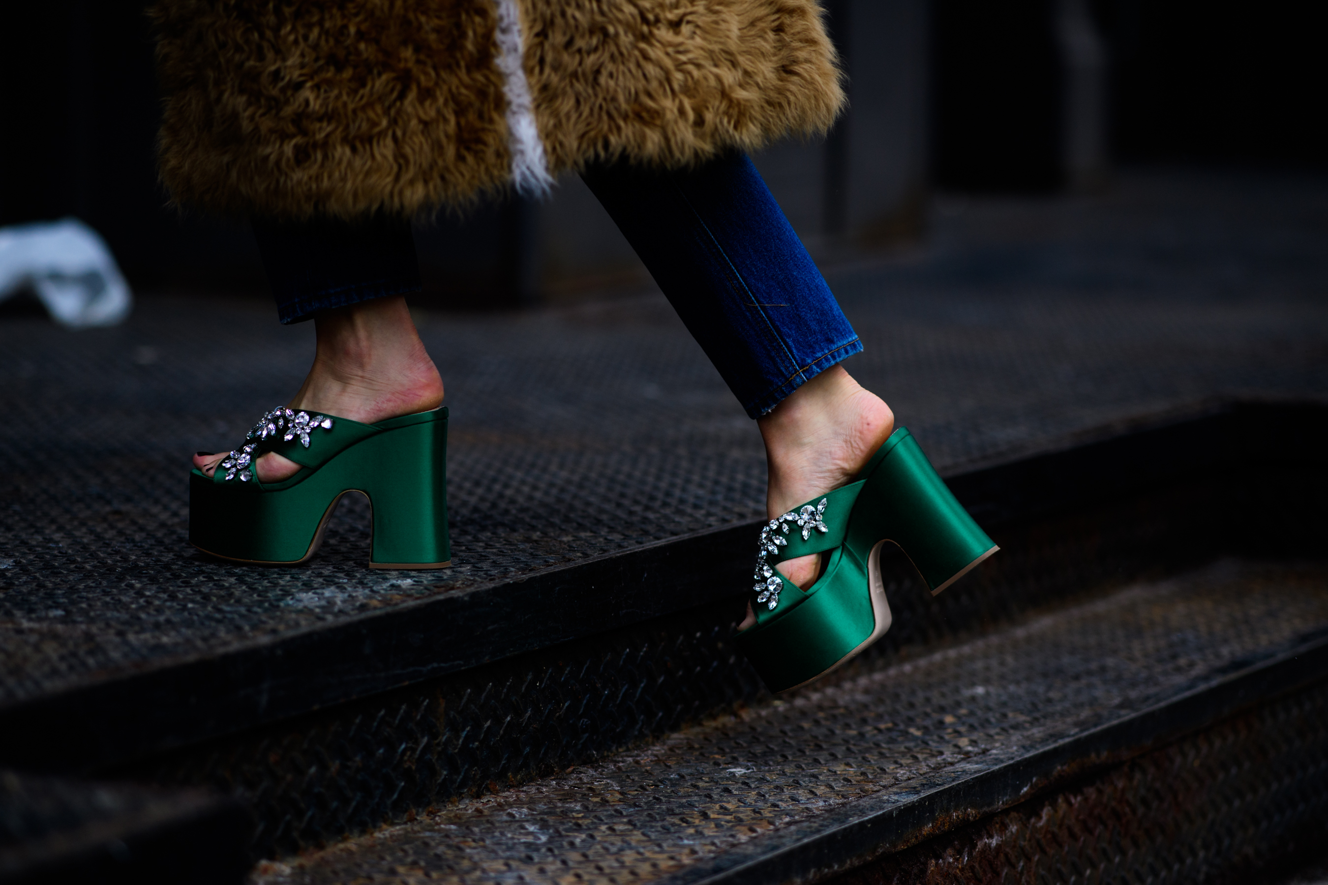 Woman wearing green platform slippers