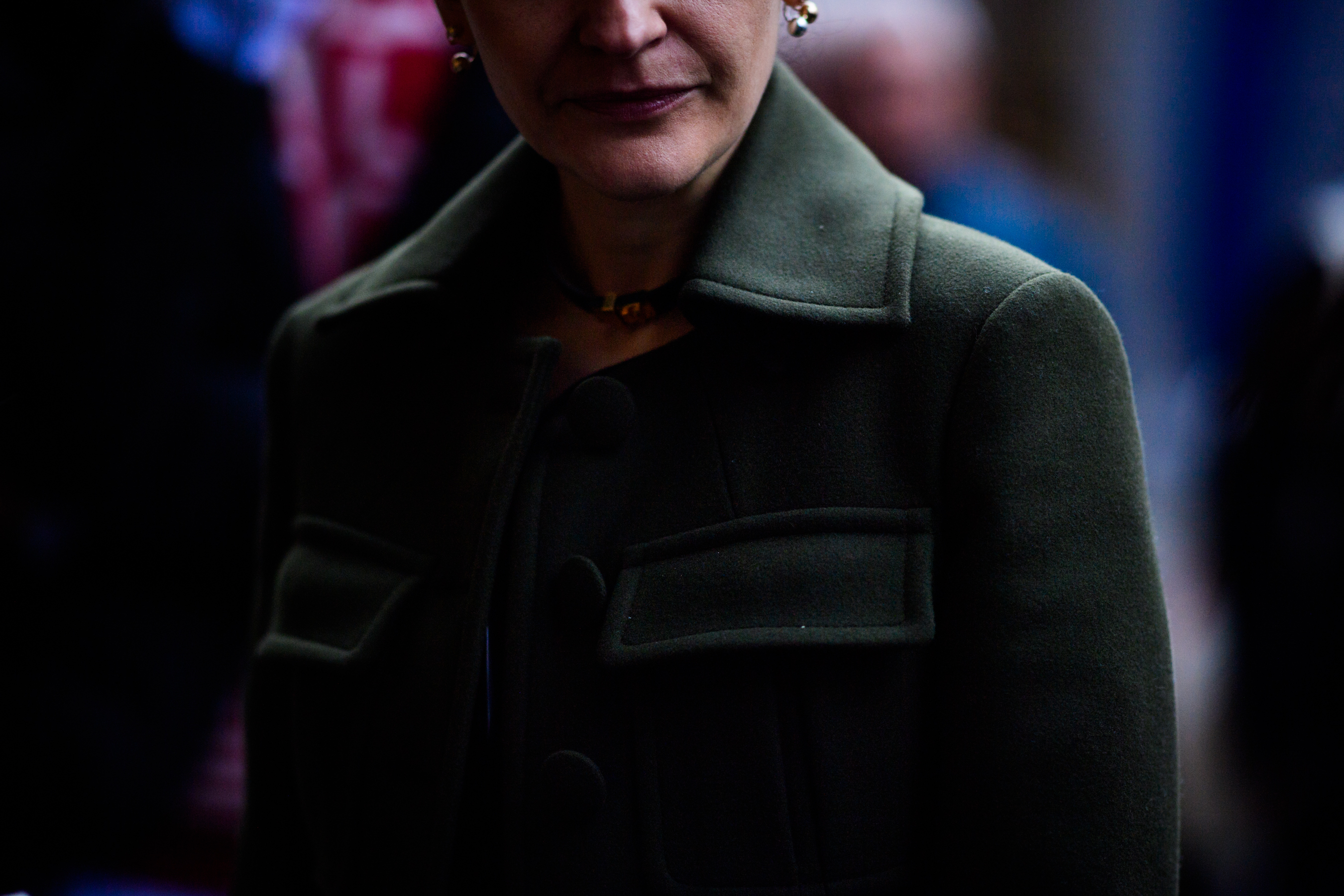 Woman wearing green jacket