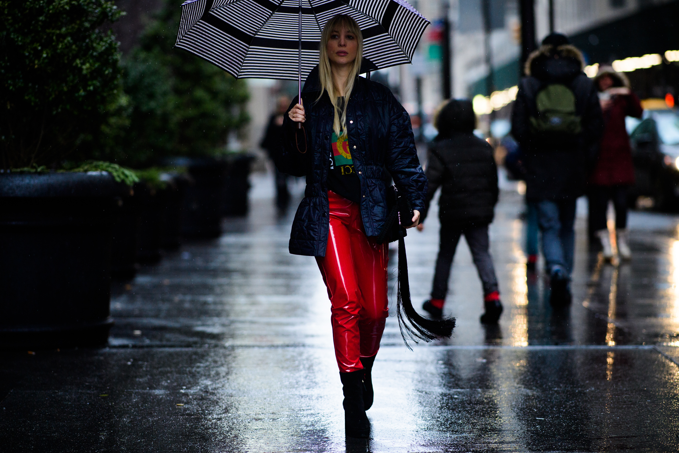 Woman wearing red leather pants