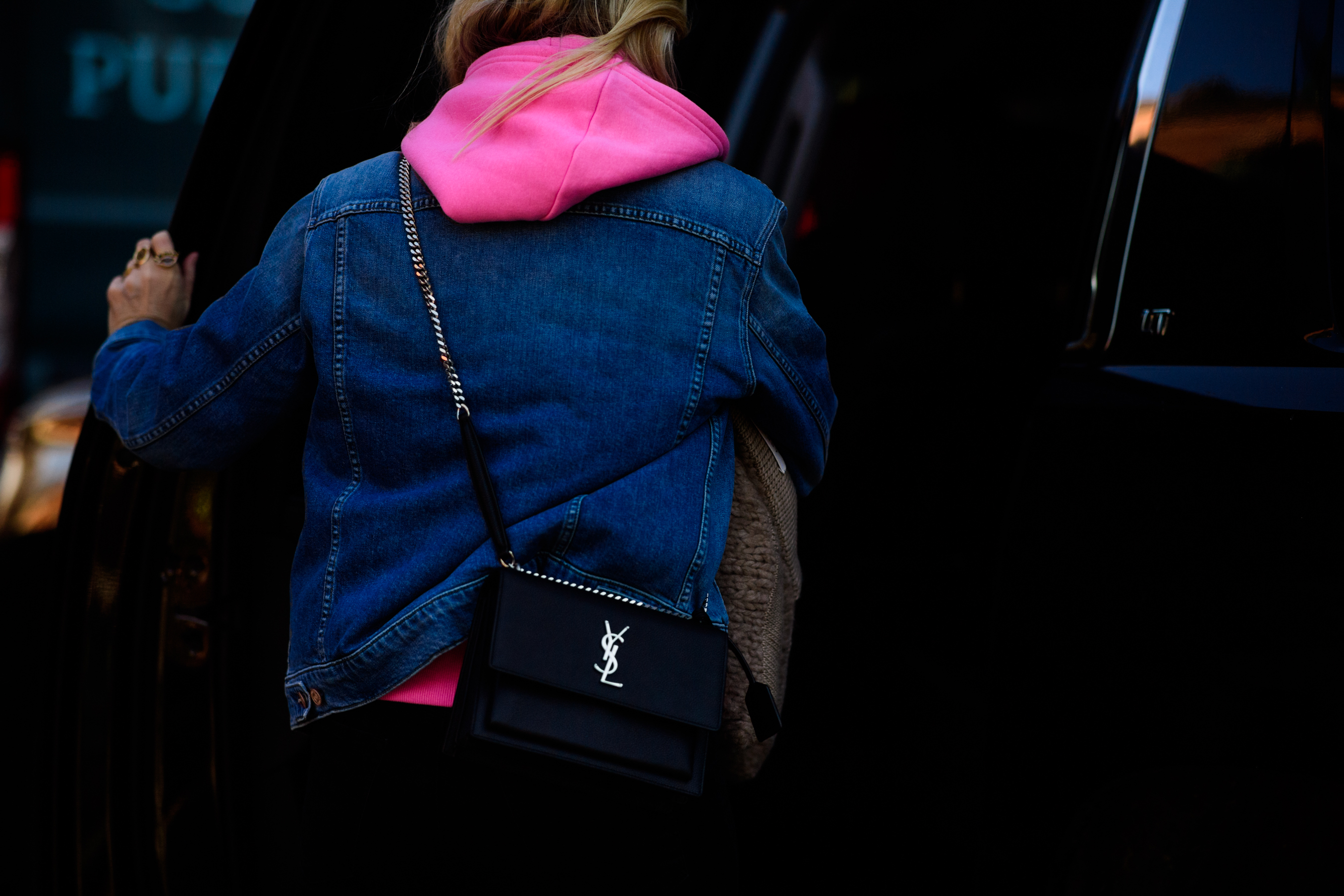 Woman wearing denim and Saint Lauren bag