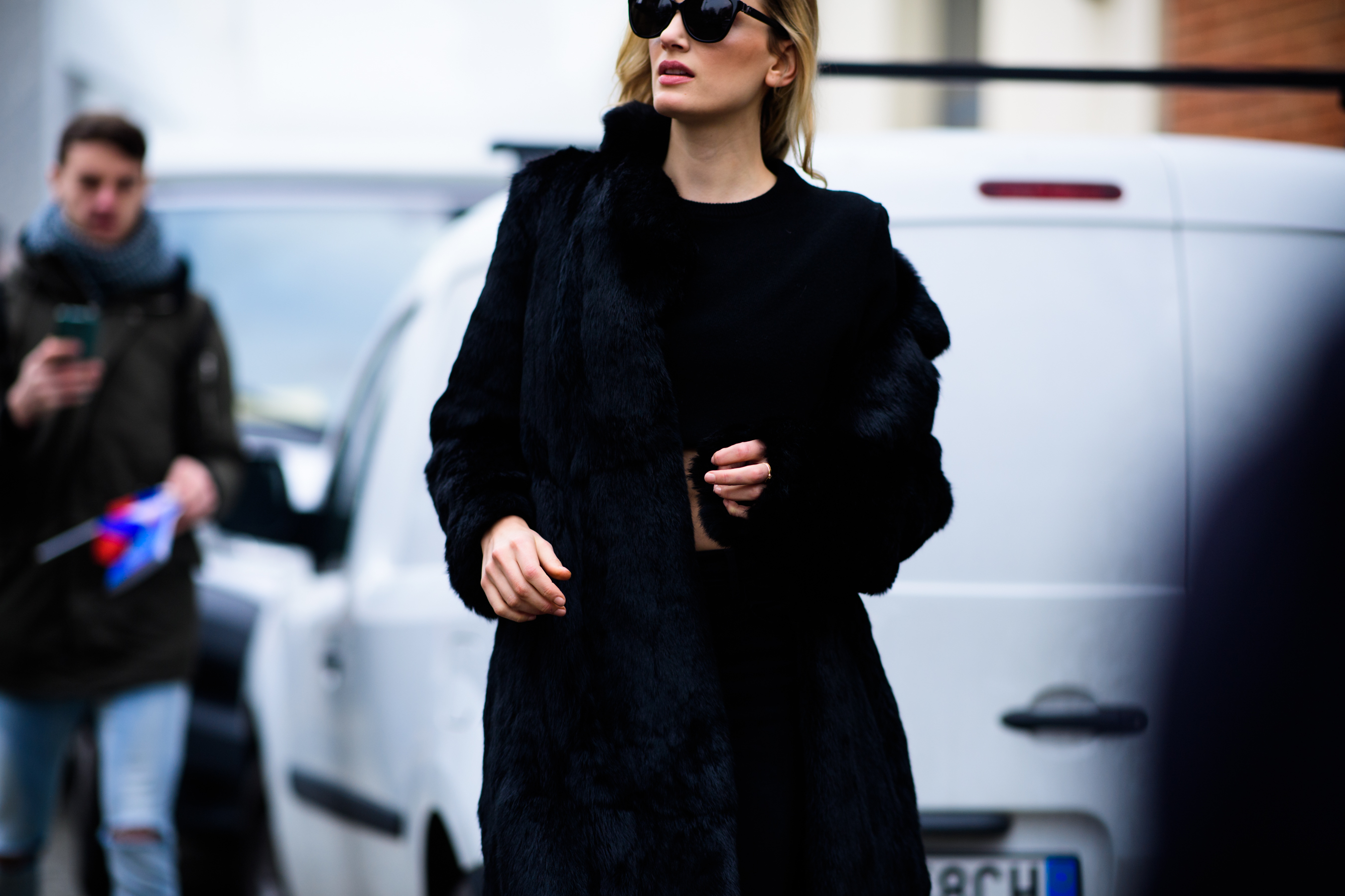 Model wearing fur coat and sunglasses