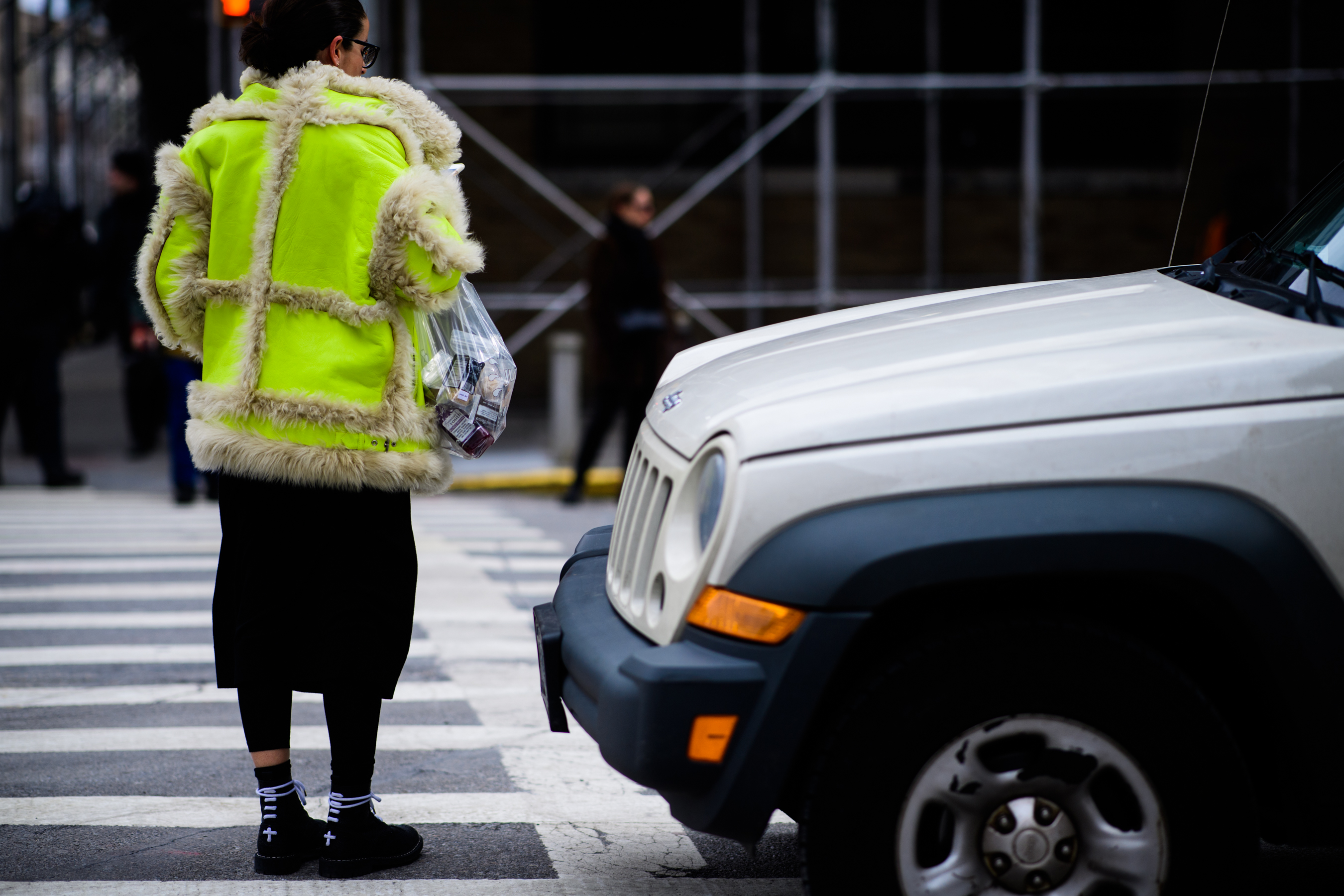 Woman wearing bright yellow jacket