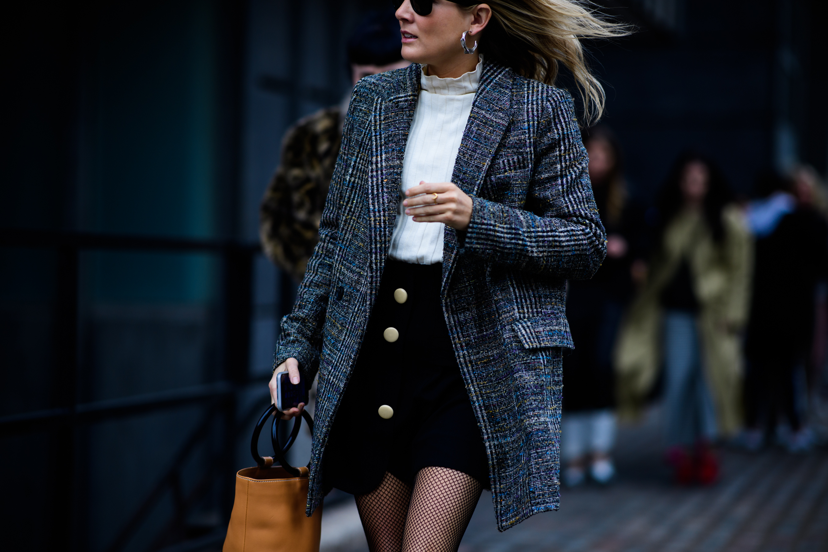 Editor wearing grey coat