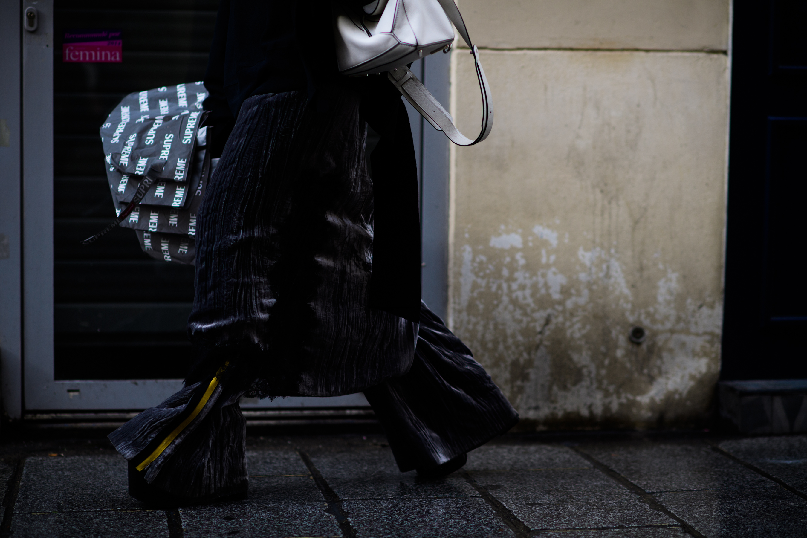Woman with white Loewe puzzle bag