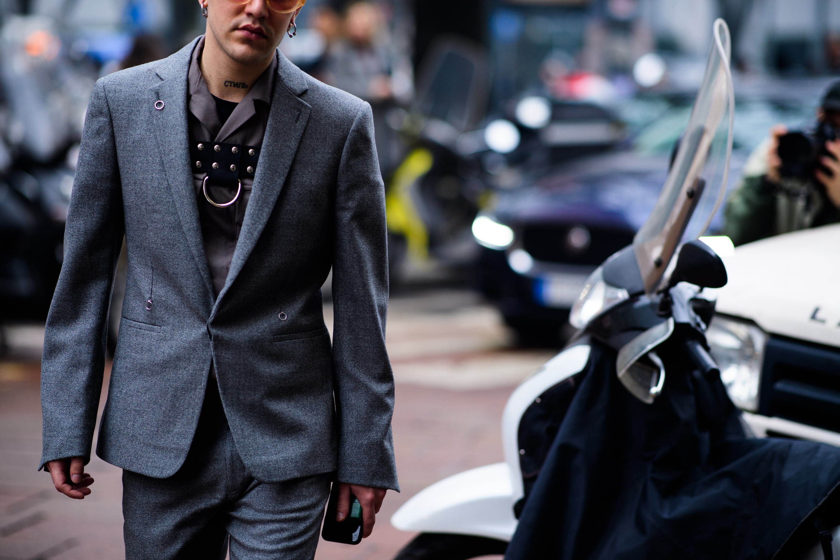 032C fashion editor wearing grey suit