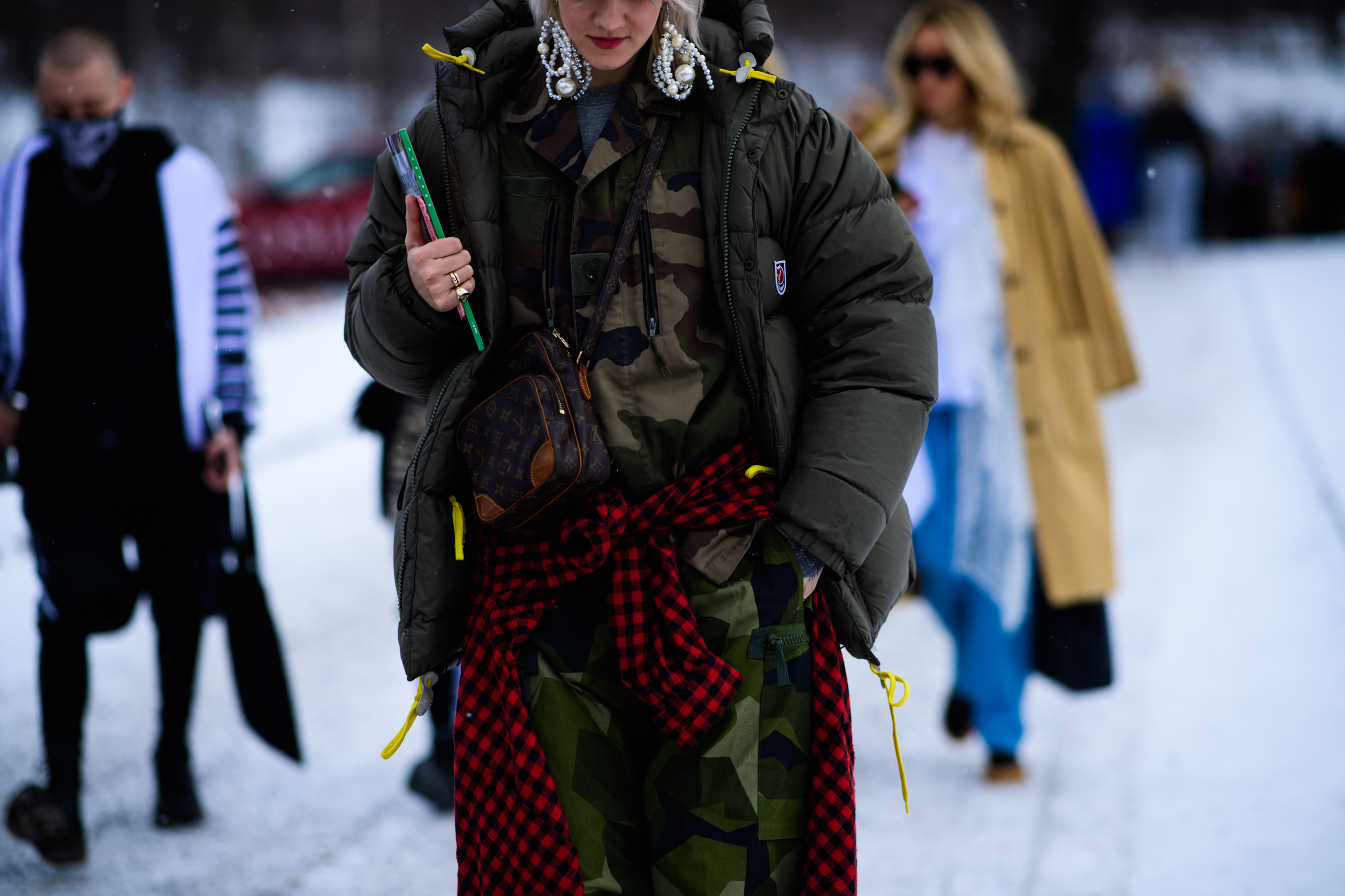 Woman wearing Louis Vuitton handbag