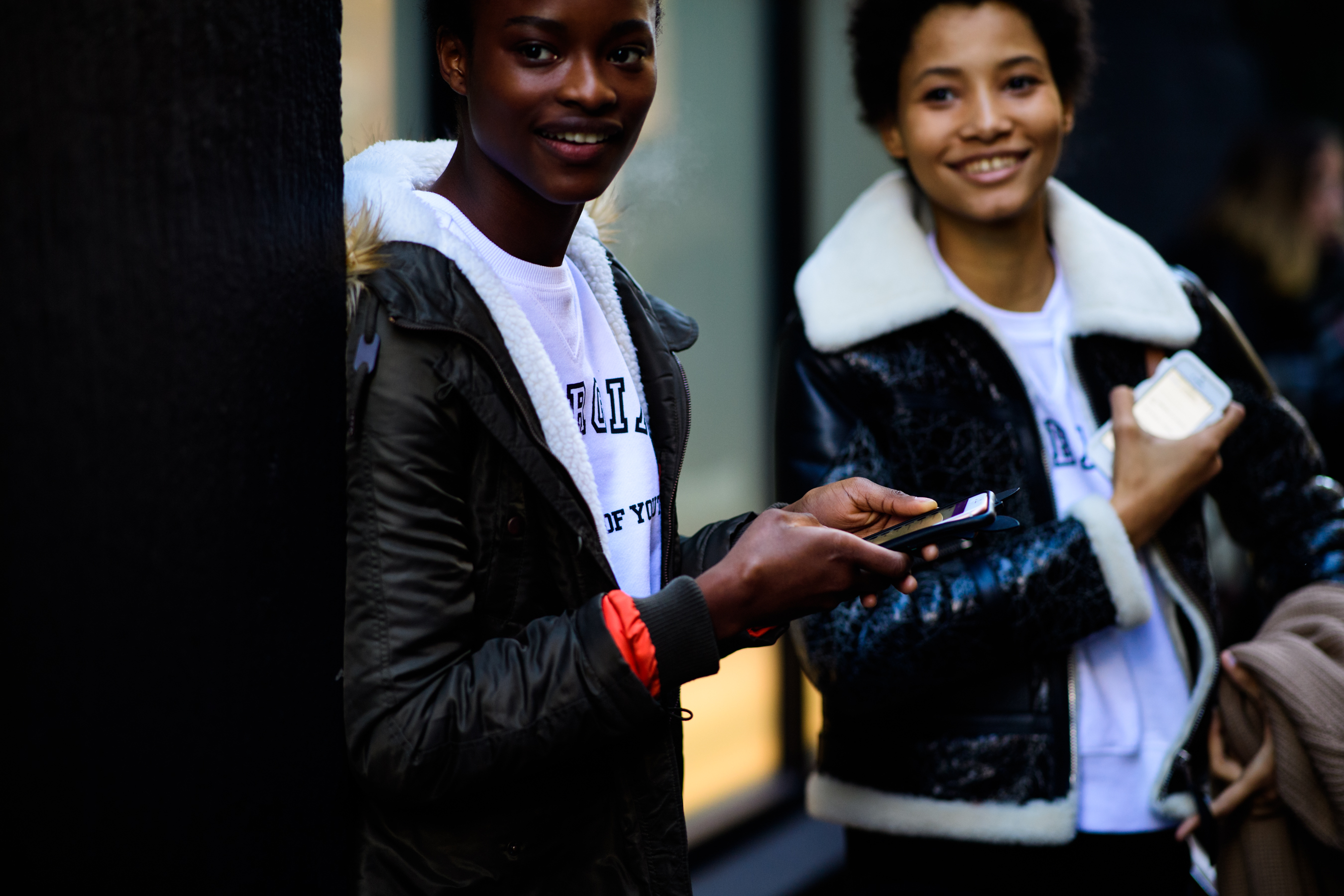 Women wearing white hoodies