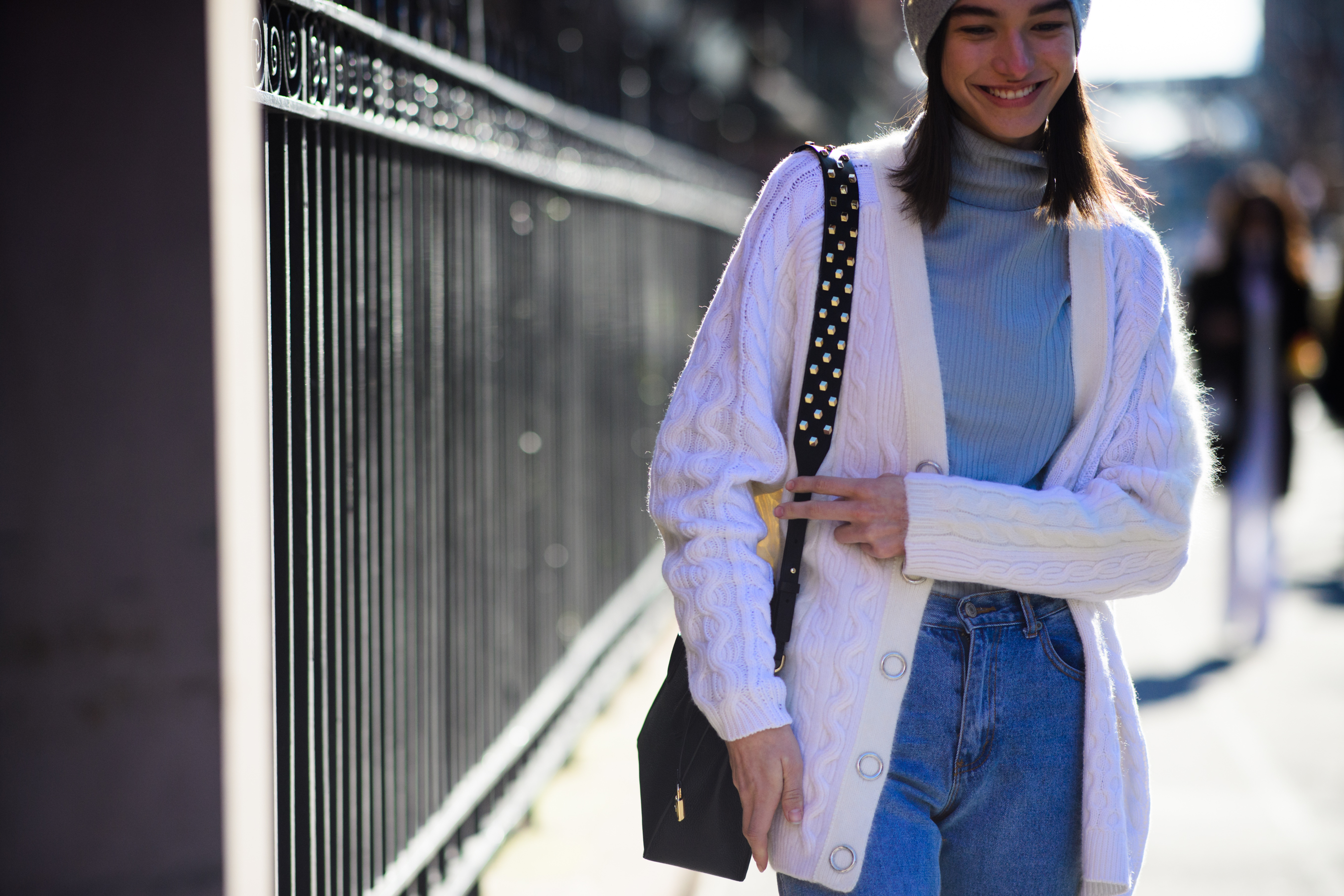 Model wearing white cardigan