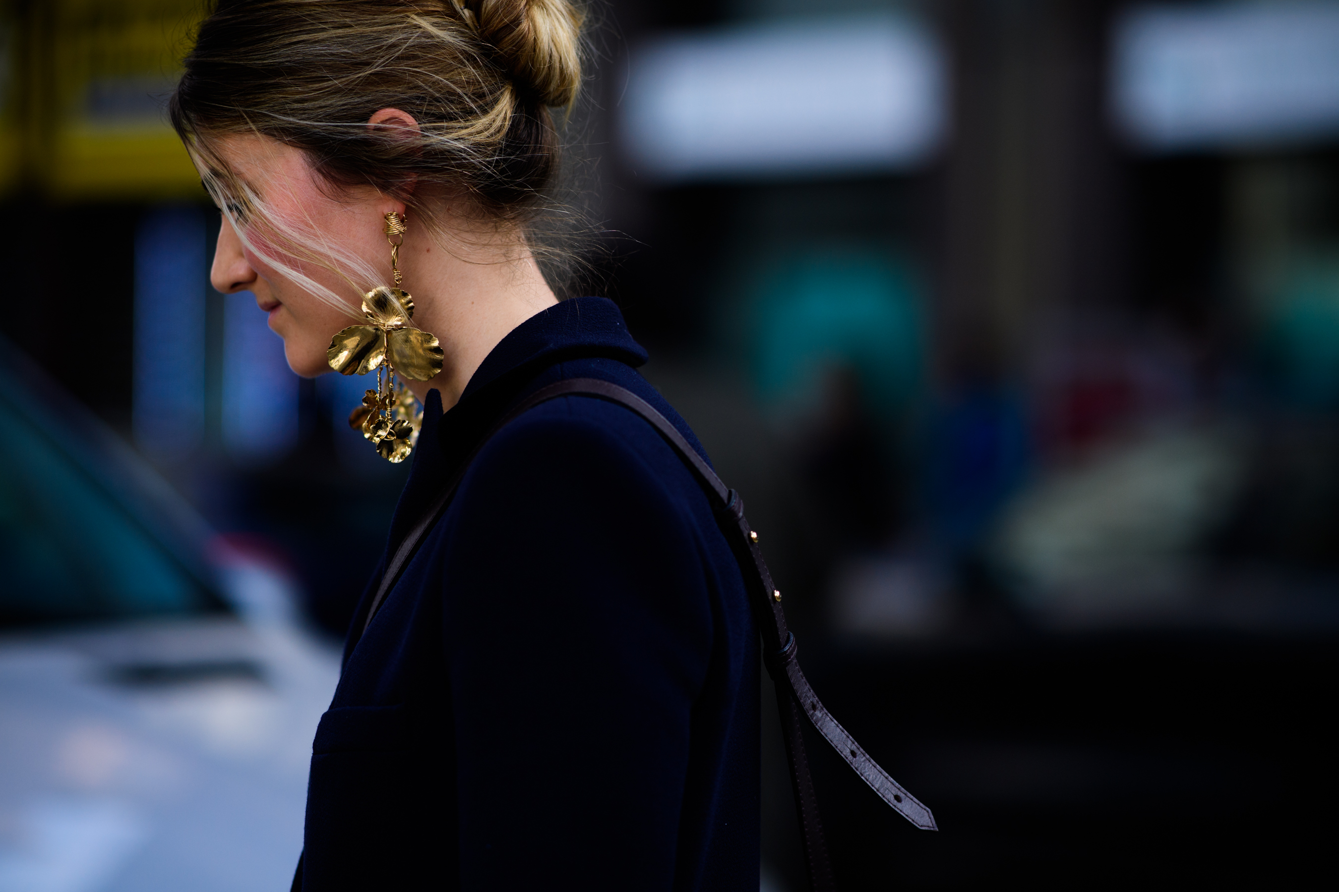 Woman wearing Balenciaga earrings