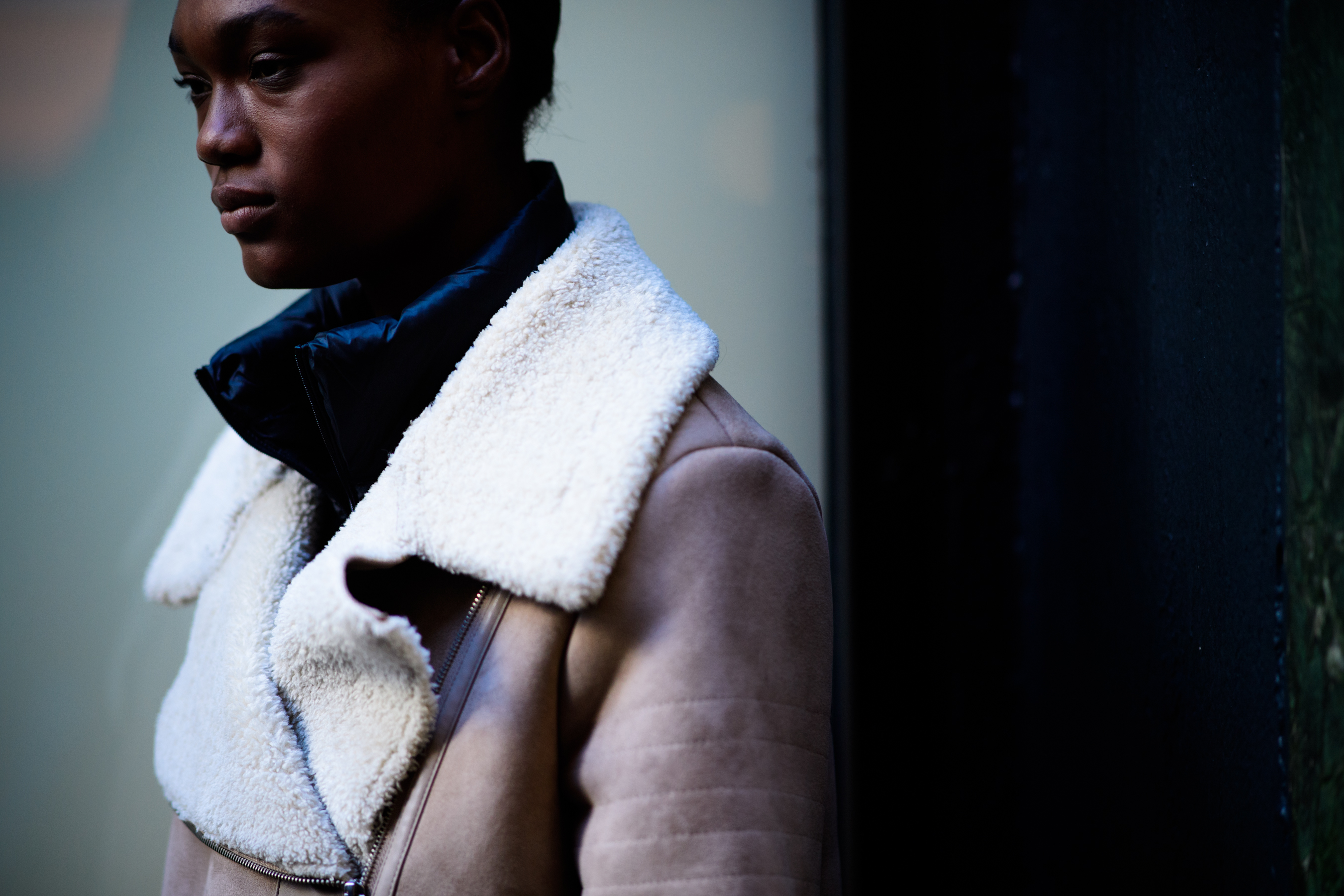 Woman wearing jacket under coat