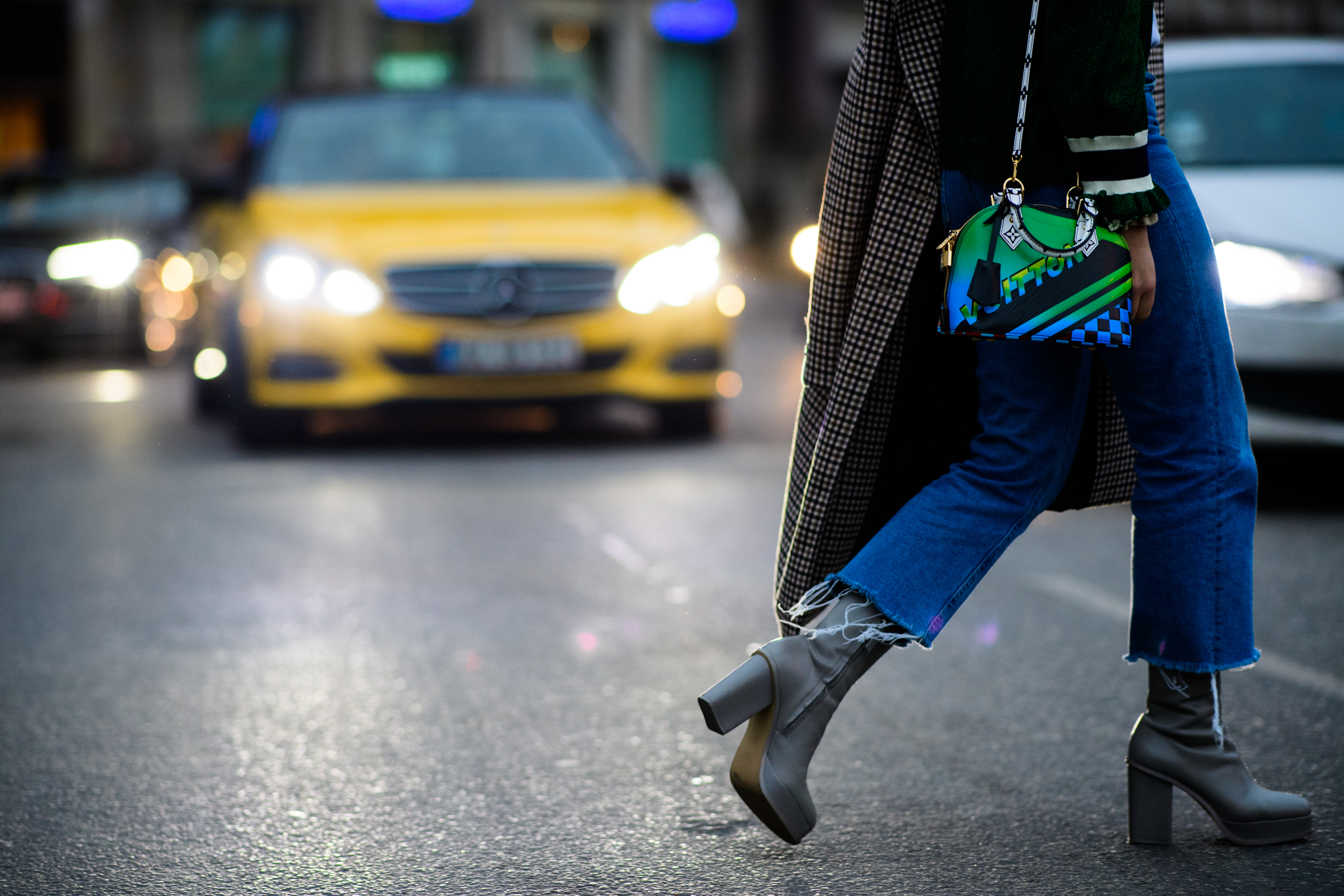 Woman wearing Louis Vuitton bag