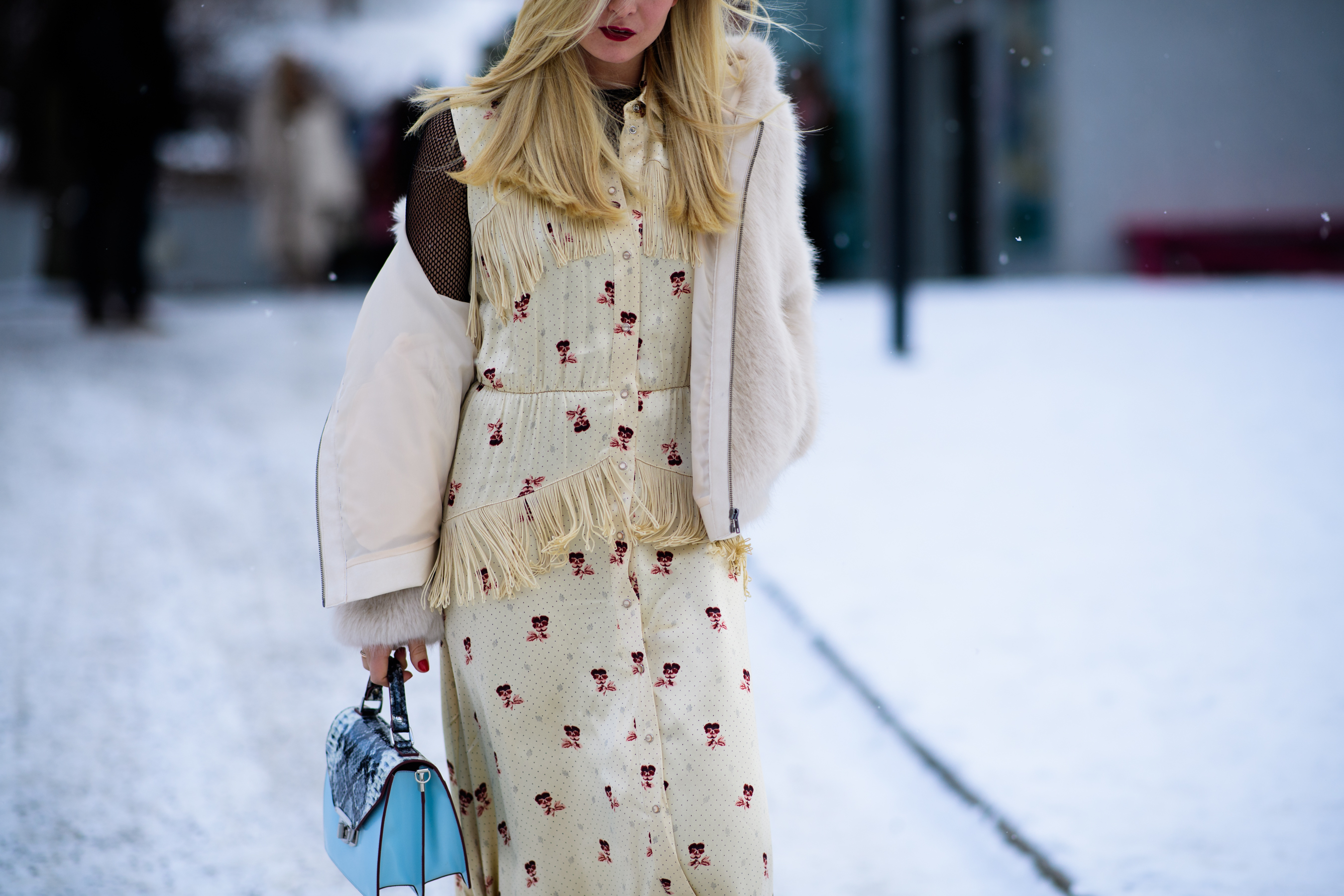 Woman with blue handbag