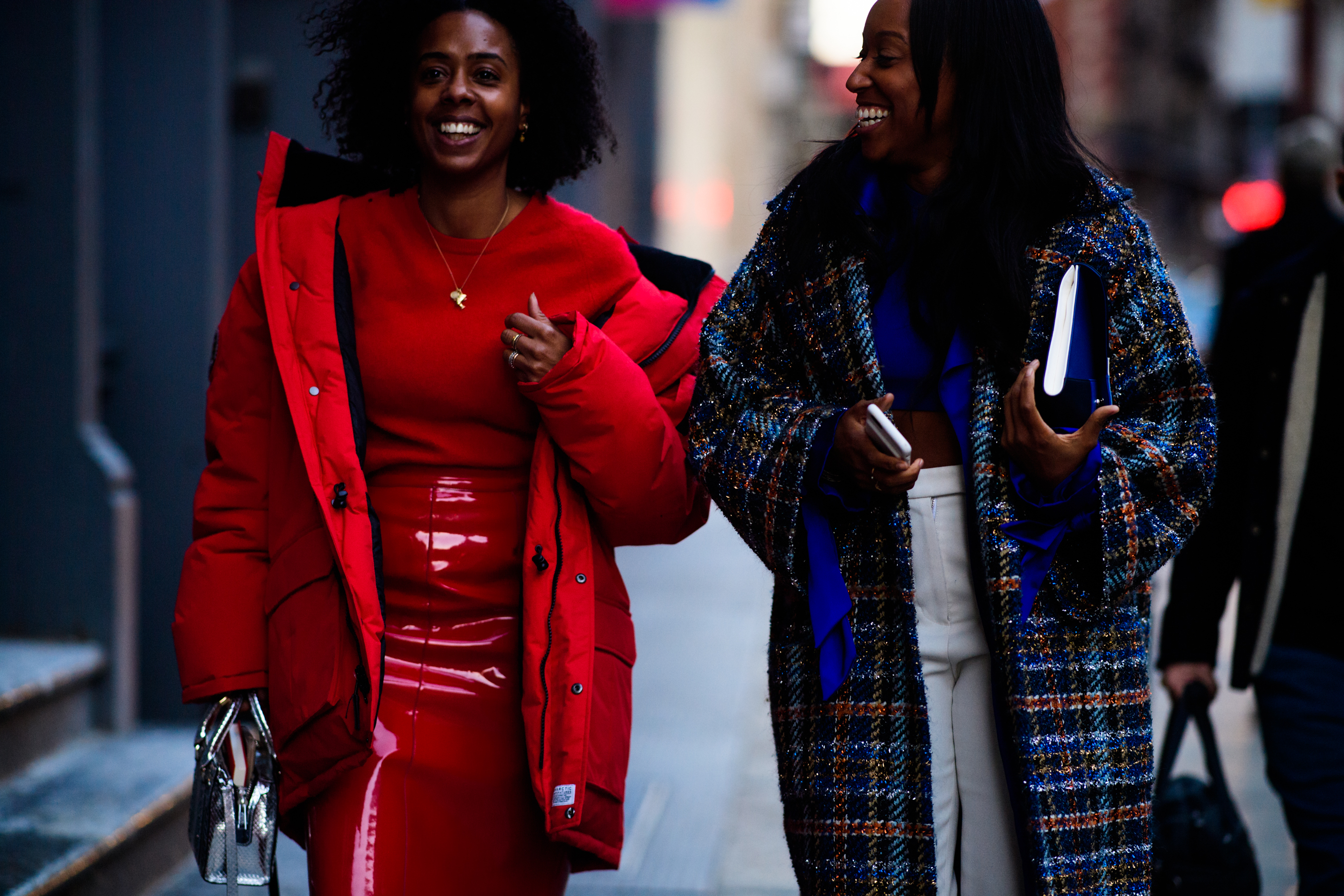 Two women wearing red and blue