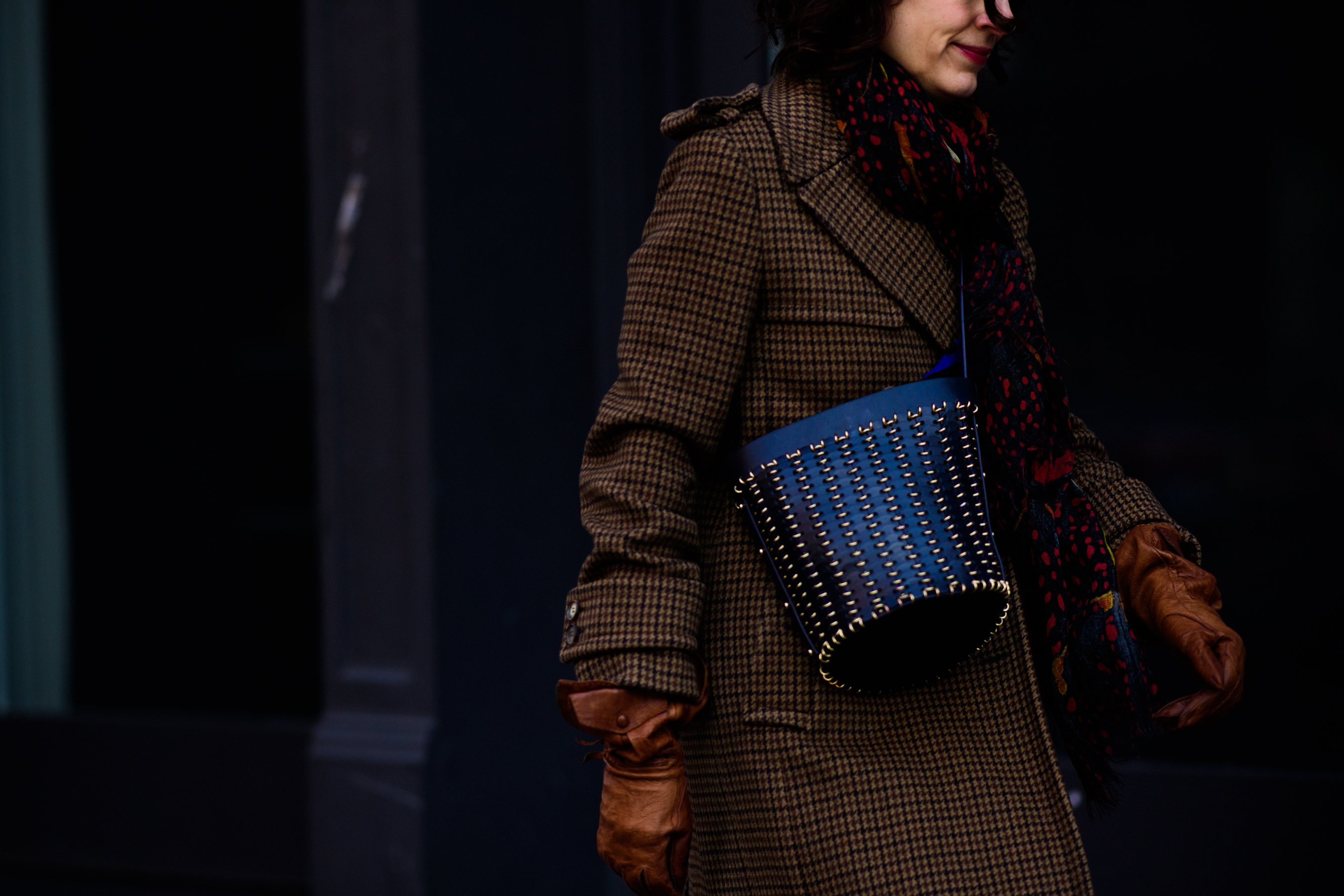 Editor with black bucket bag