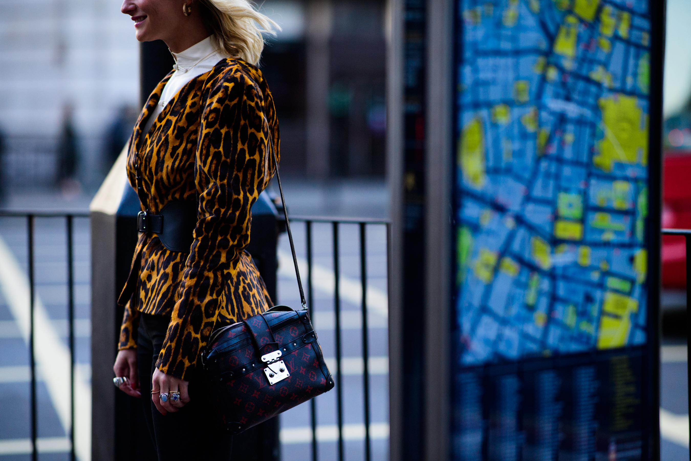 Woman wearing Louis Vuitton bag