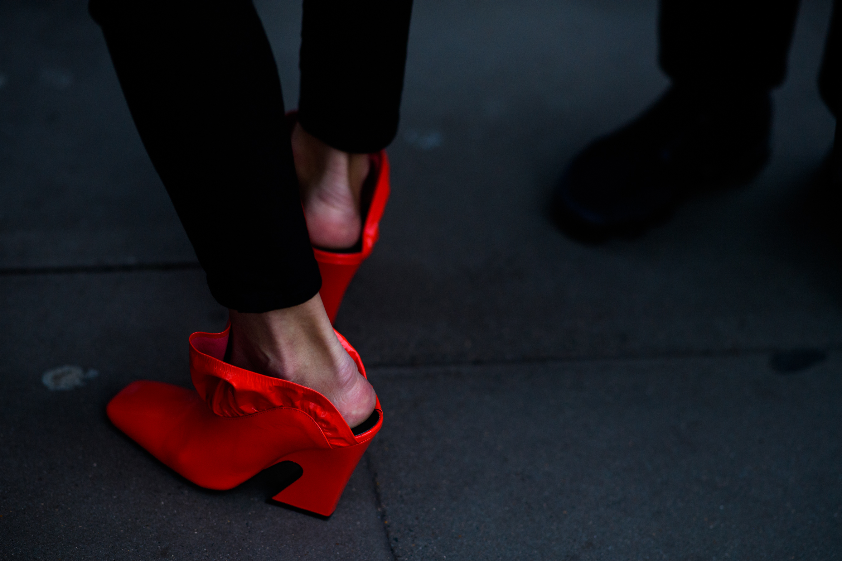 Woman wearing red shoes